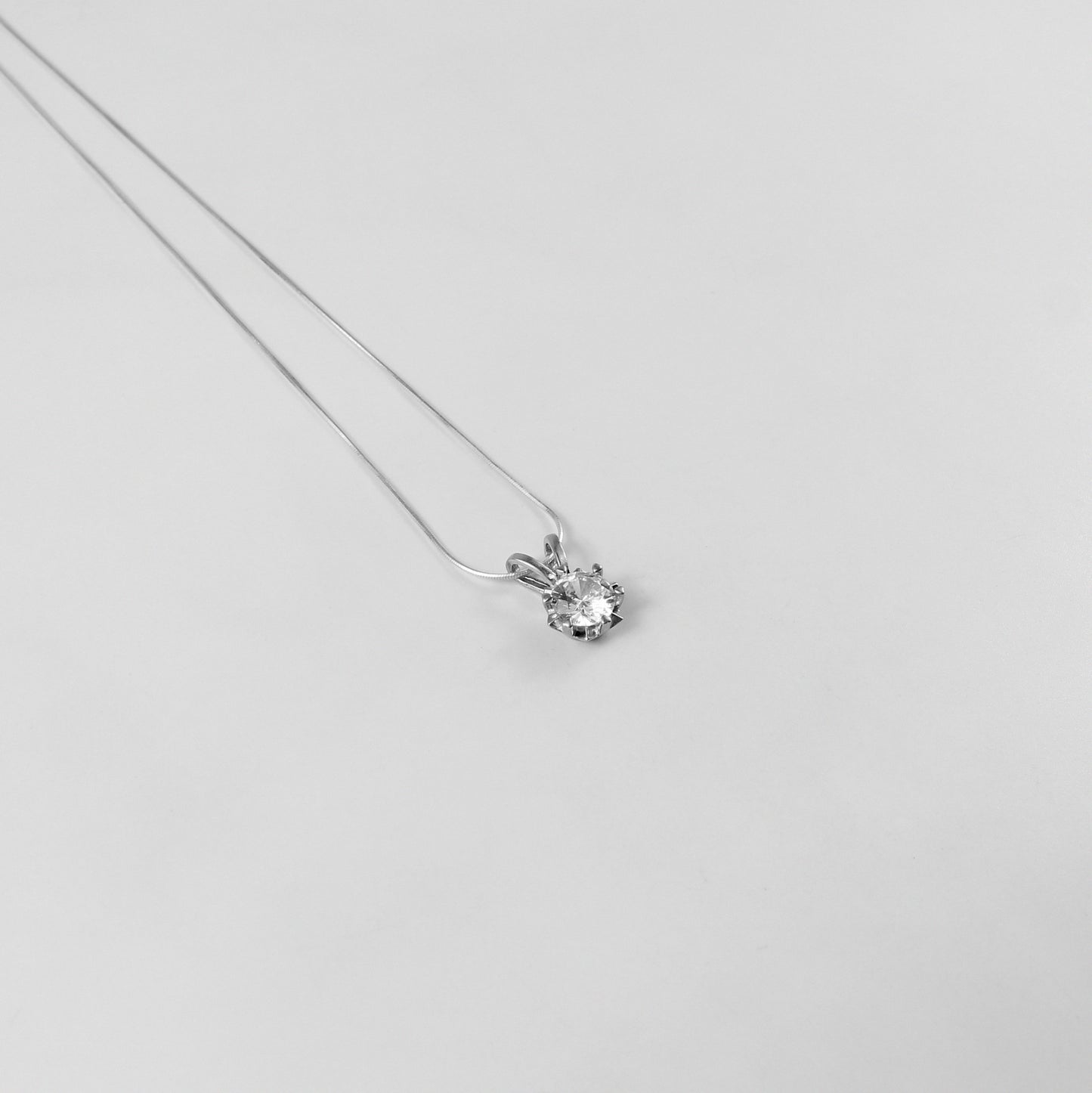 A refined 'Crystal Veil' necklace, crafted from premium 925 sterling silver, showcasing a captivating crystal-inspired design with a touch of timeless elegance.