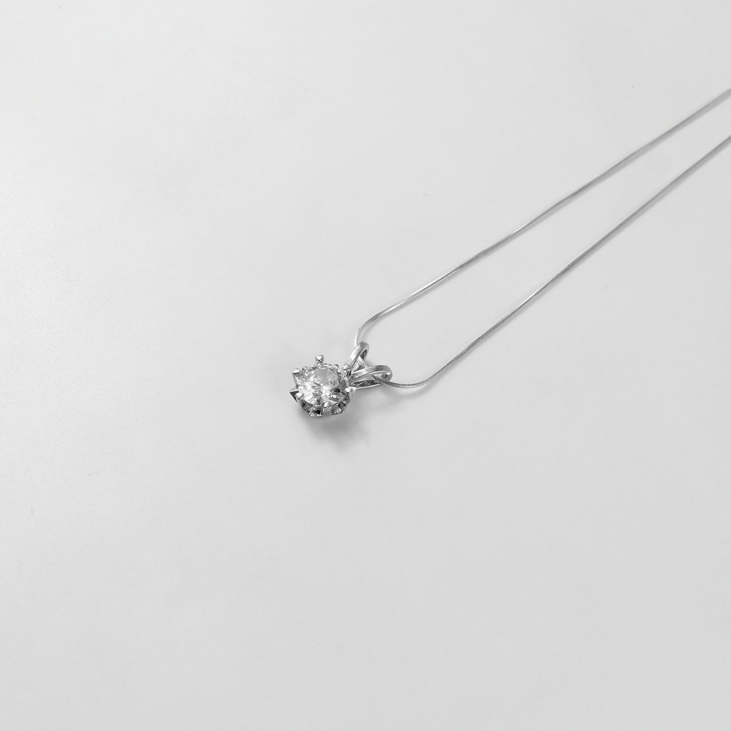 A refined 'Crystal Veil' necklace, crafted from premium 925 sterling silver, showcasing a captivating crystal-inspired design with a touch of timeless elegance.