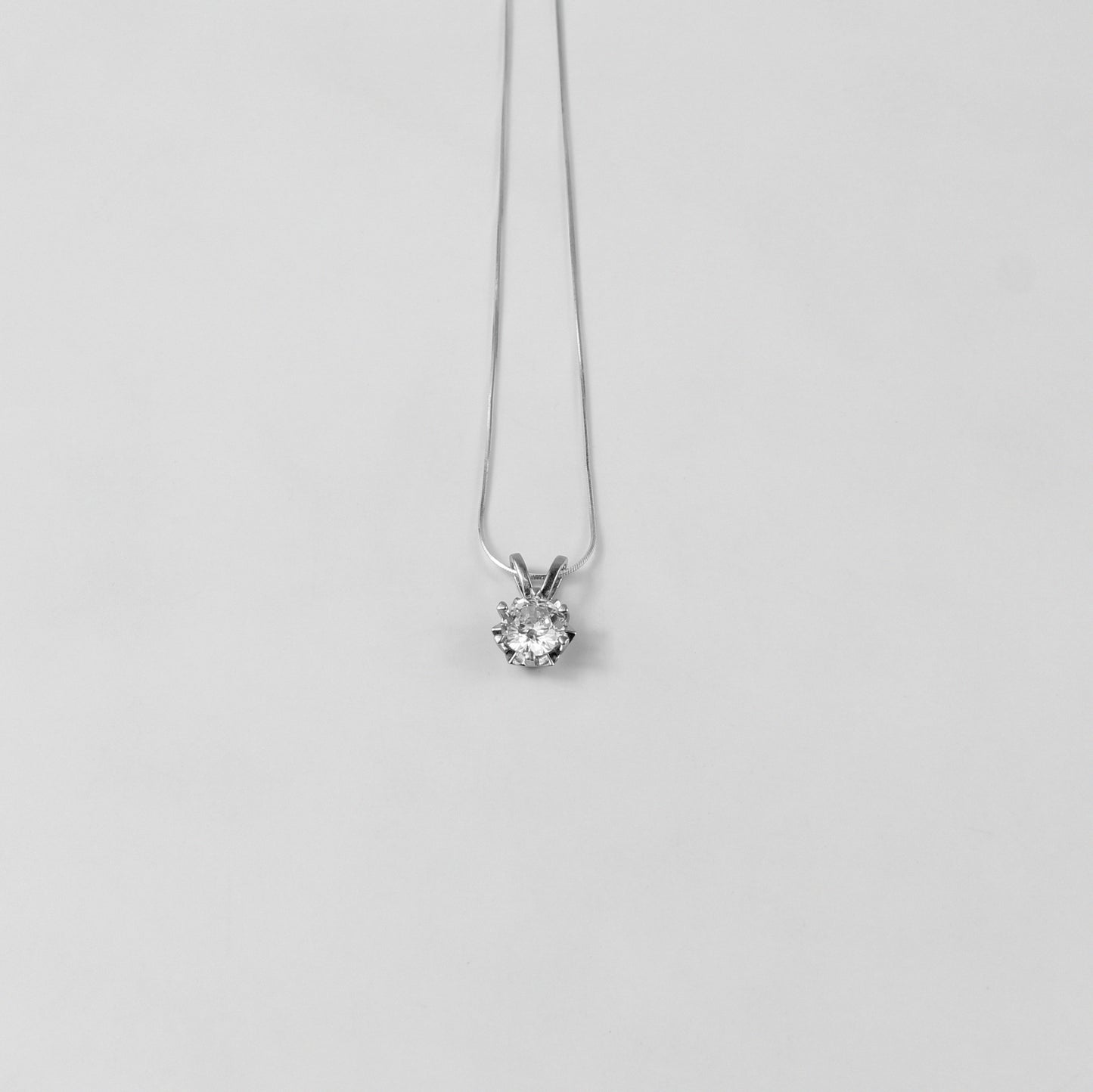 A refined 'Crystal Veil' necklace, crafted from premium 925 sterling silver, showcasing a captivating crystal-inspired design with a touch of timeless elegance.
