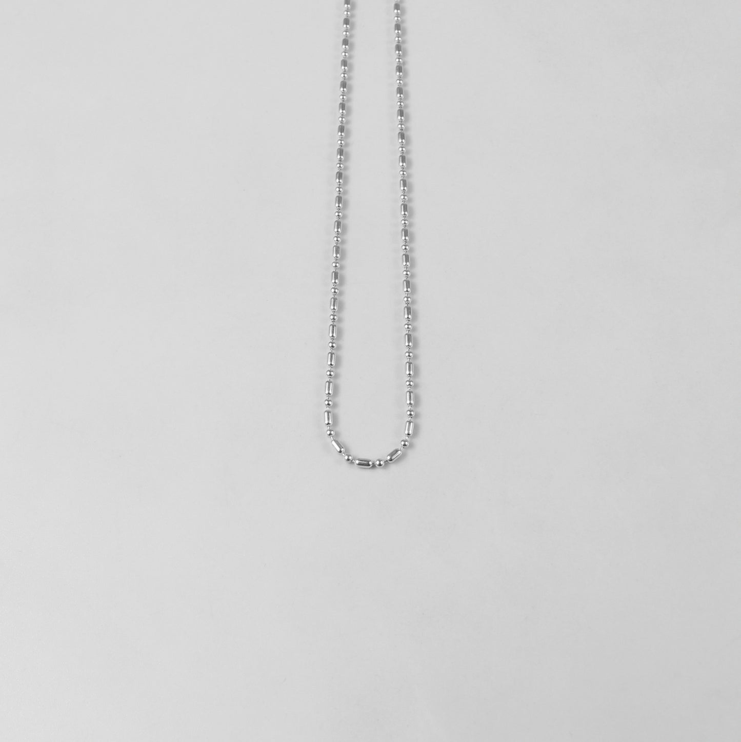 925 sterling silver necklace named 'Ethereal Silver Bead,' featuring a delicate strand of luminous silver beads that exude elegance and simplicity. Its refined design captures an otherworldly charm, making it a versatile accessory for both casual and formal occasions.