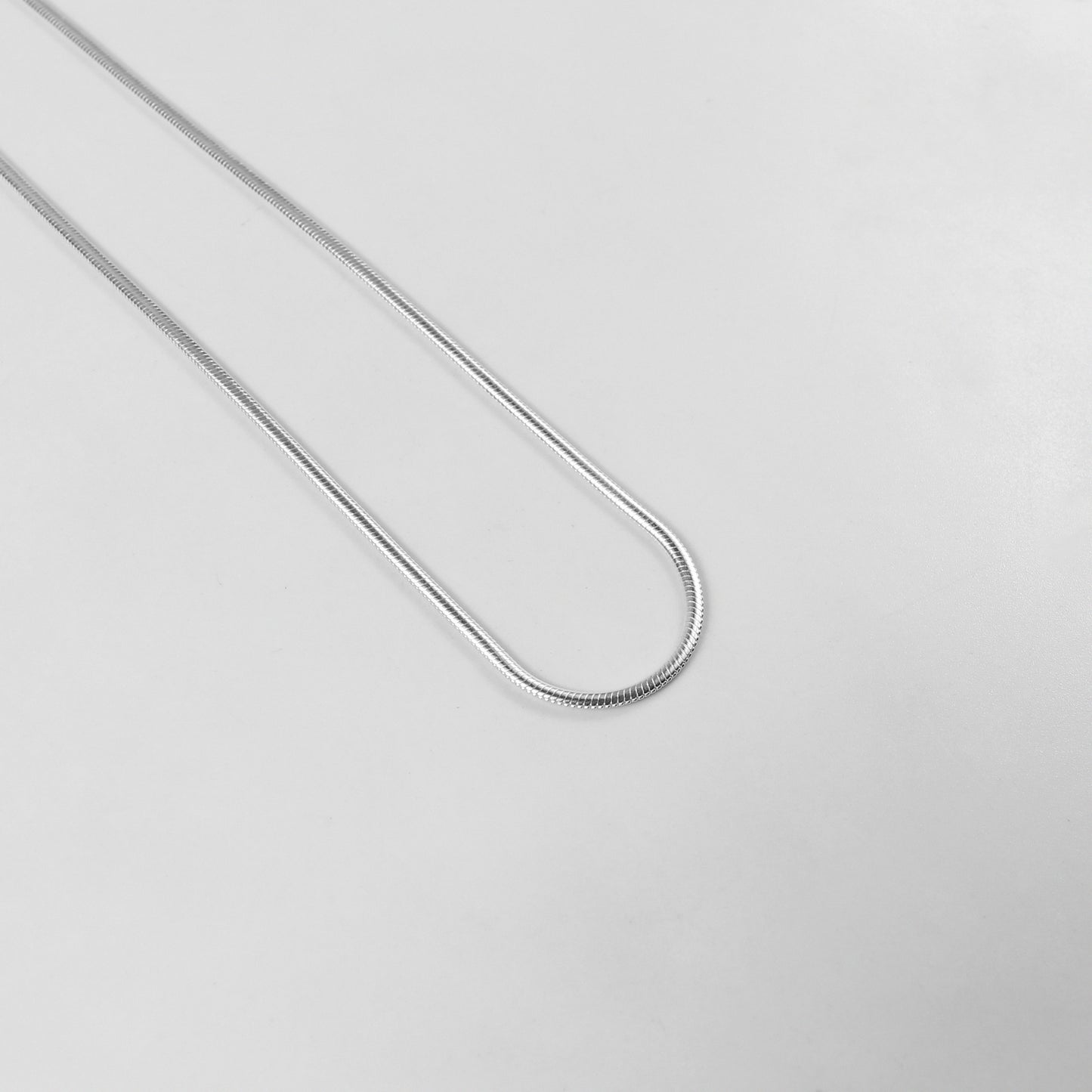 Flat Snake Necklace - A sophisticated 925 sterling silver necklace by GetTheJuice, featuring a sleek flat snake chain design that offers a refined and elegant touch to any ensemble.