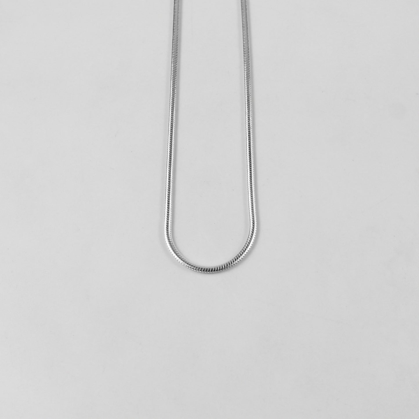 Flat Snake Necklace - A sophisticated 925 sterling silver necklace by GetTheJuice, featuring a sleek flat snake chain design that offers a refined and elegant touch to any ensemble.