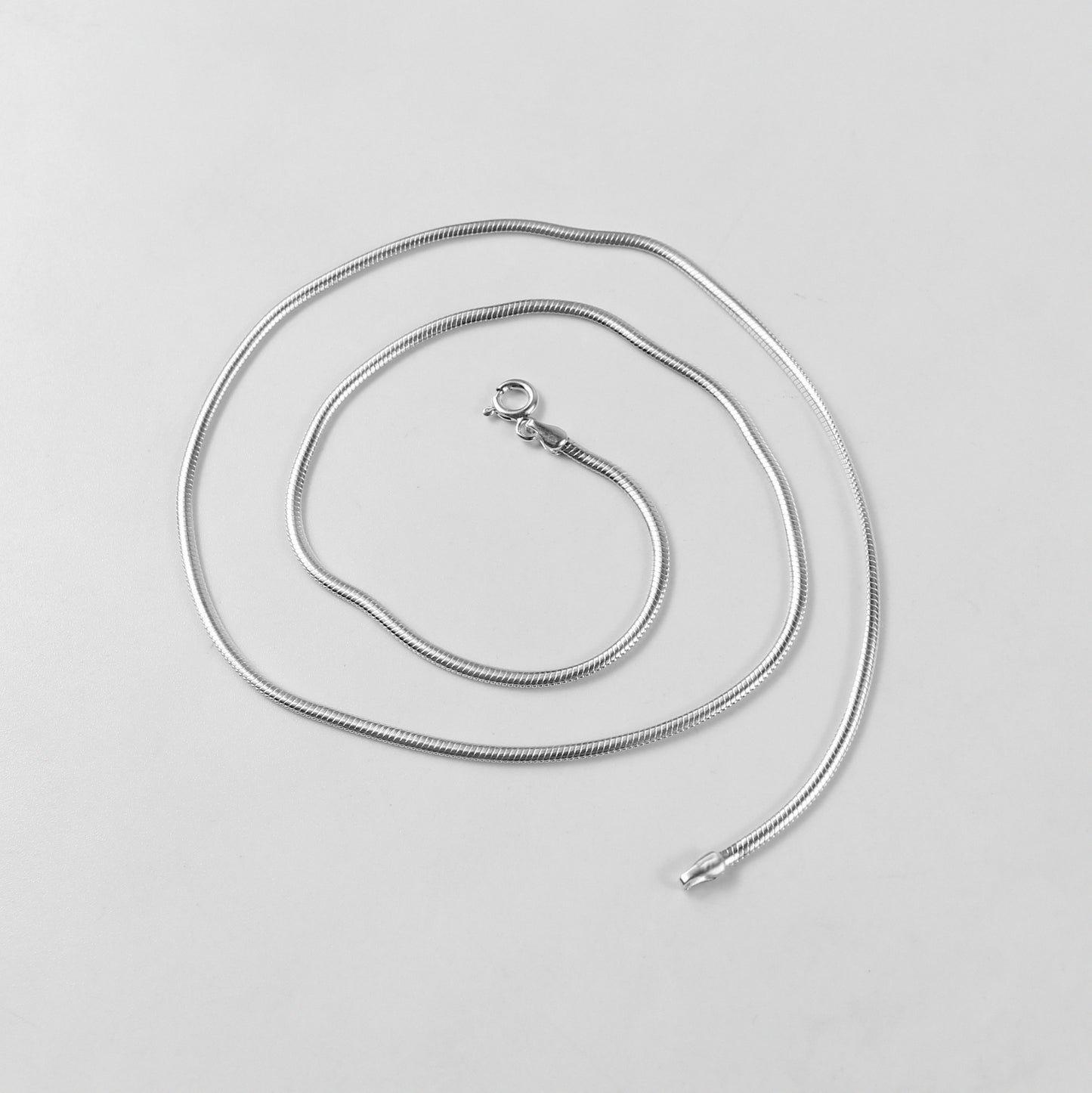 Flat Snake Necklace - A sophisticated 925 sterling silver necklace by GetTheJuice, featuring a sleek flat snake chain design that offers a refined and elegant touch to any ensemble.