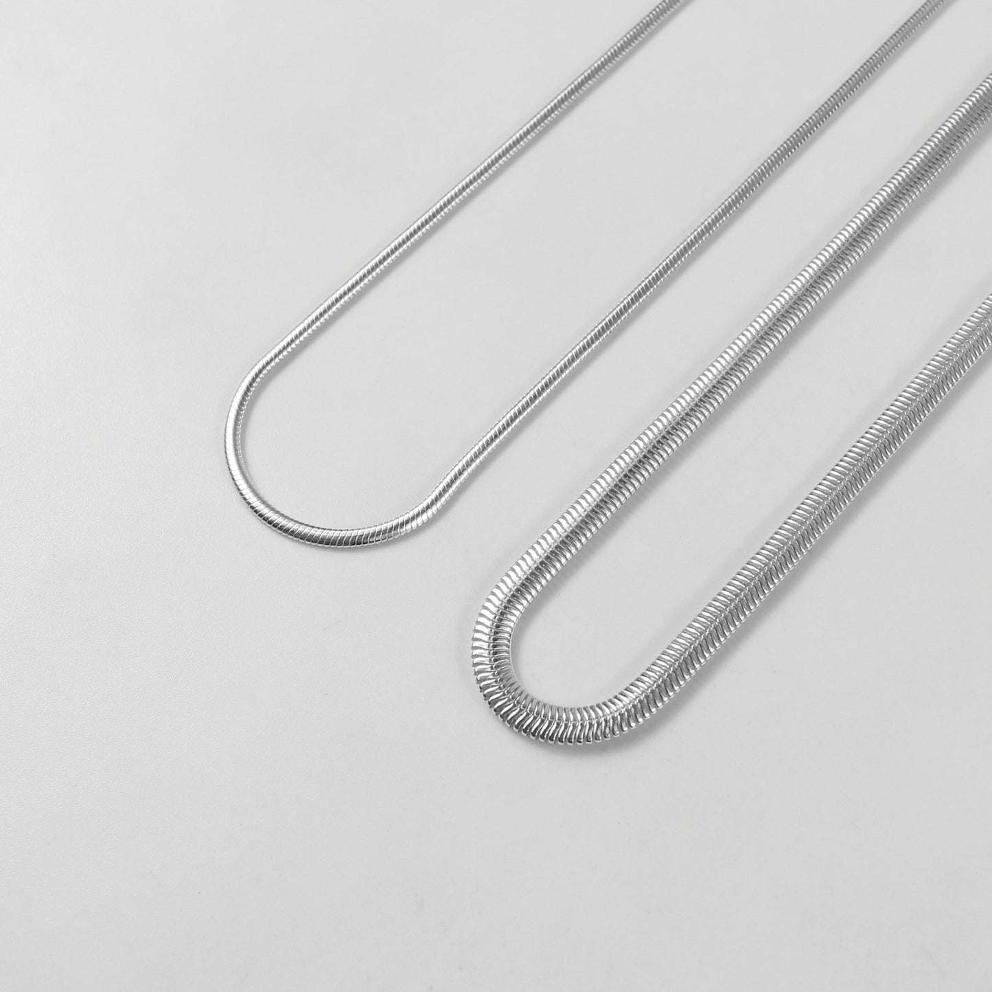 Flat Snake Necklace - A sophisticated 925 sterling silver necklace by GetTheJuice, featuring a sleek flat snake chain design that offers a refined and elegant touch to any ensemble.