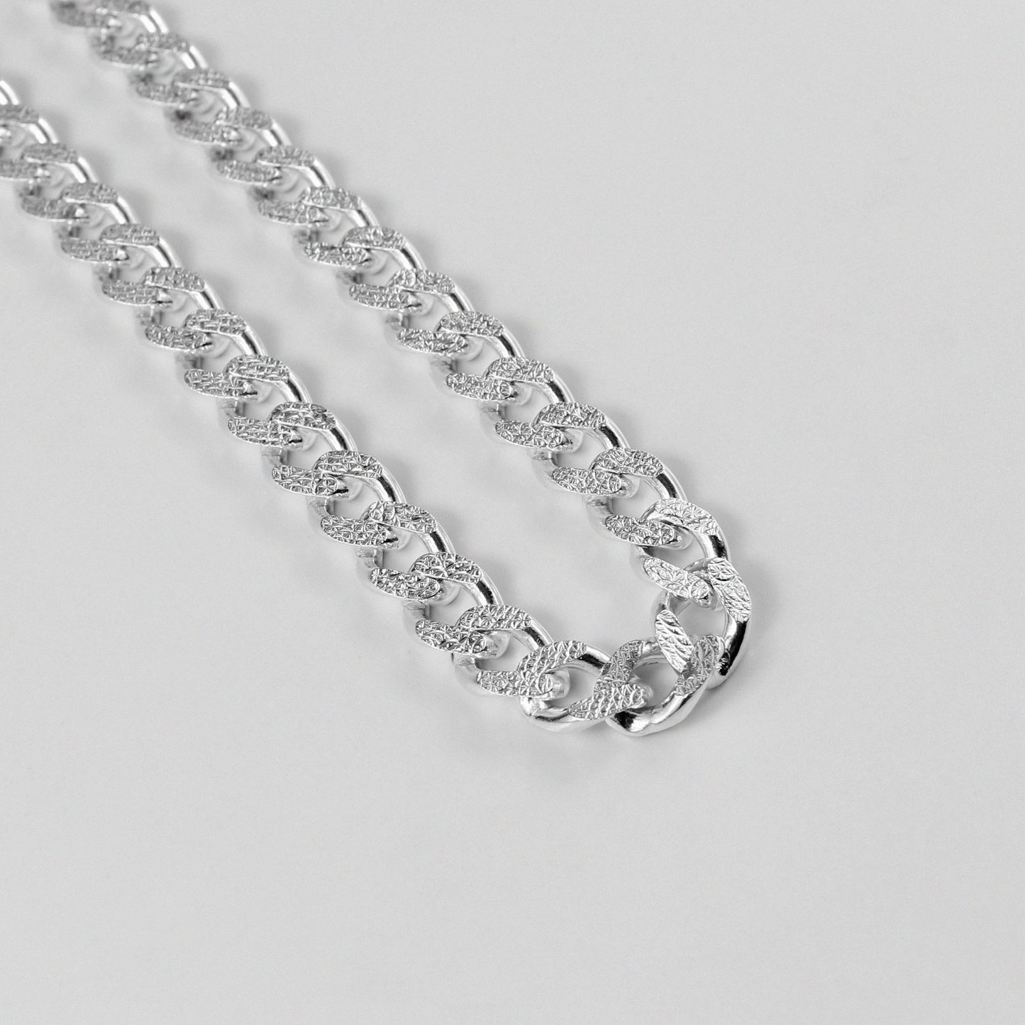 Frosted Fusion Cuban Necklace - A distinctive 925 sterling silver necklace by GetTheJuice, featuring a unique frosted finish on the classic Cuban link design, blending elegance with contemporary style.
