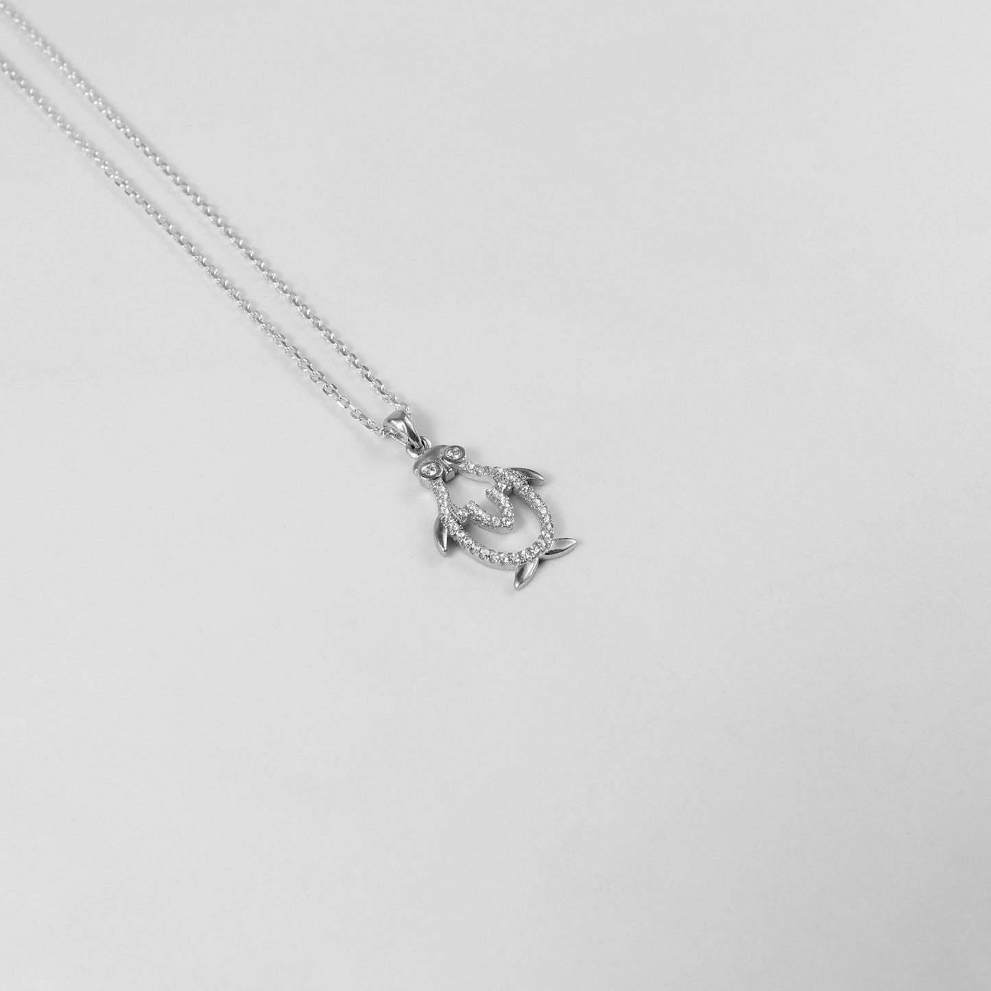 An elegant necklace named 'Icy Wings,' crafted from 925 sterling silver. Its design showcases wing-like motifs with a frosty shimmer, radiating grace and freedom.