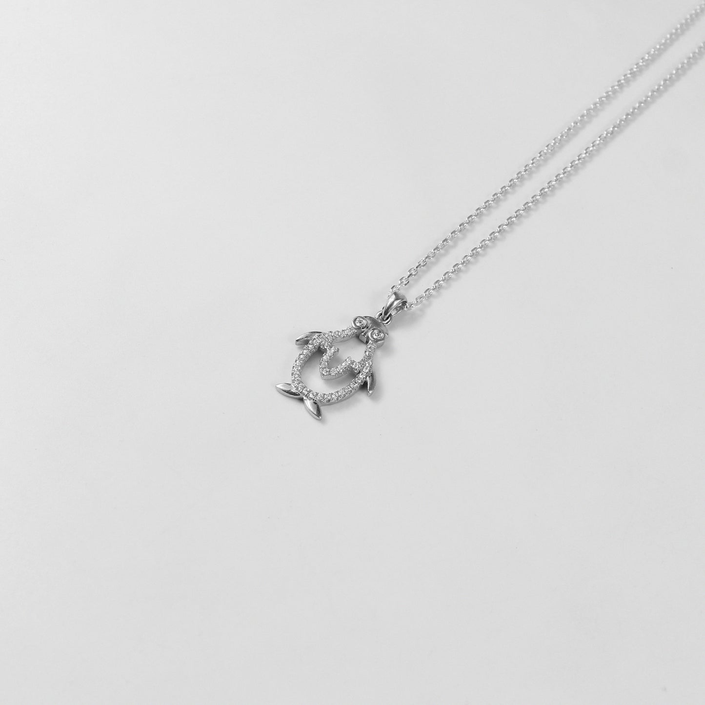 An elegant necklace named 'Icy Wings,' crafted from 925 sterling silver. Its design showcases wing-like motifs with a frosty shimmer, radiating grace and freedom.