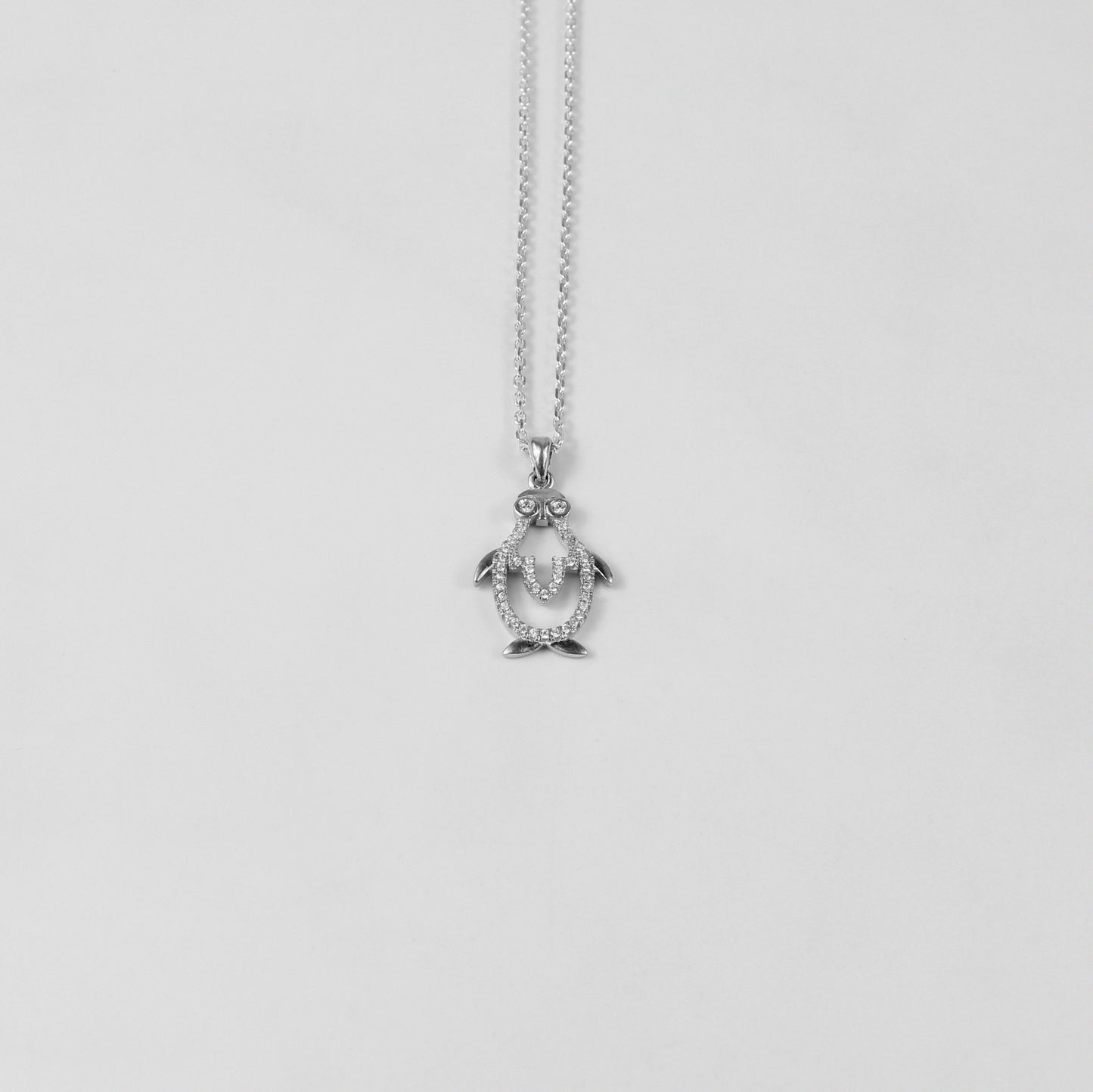 An elegant necklace named 'Icy Wings,' crafted from 925 sterling silver. Its design showcases wing-like motifs with a frosty shimmer, radiating grace and freedom.