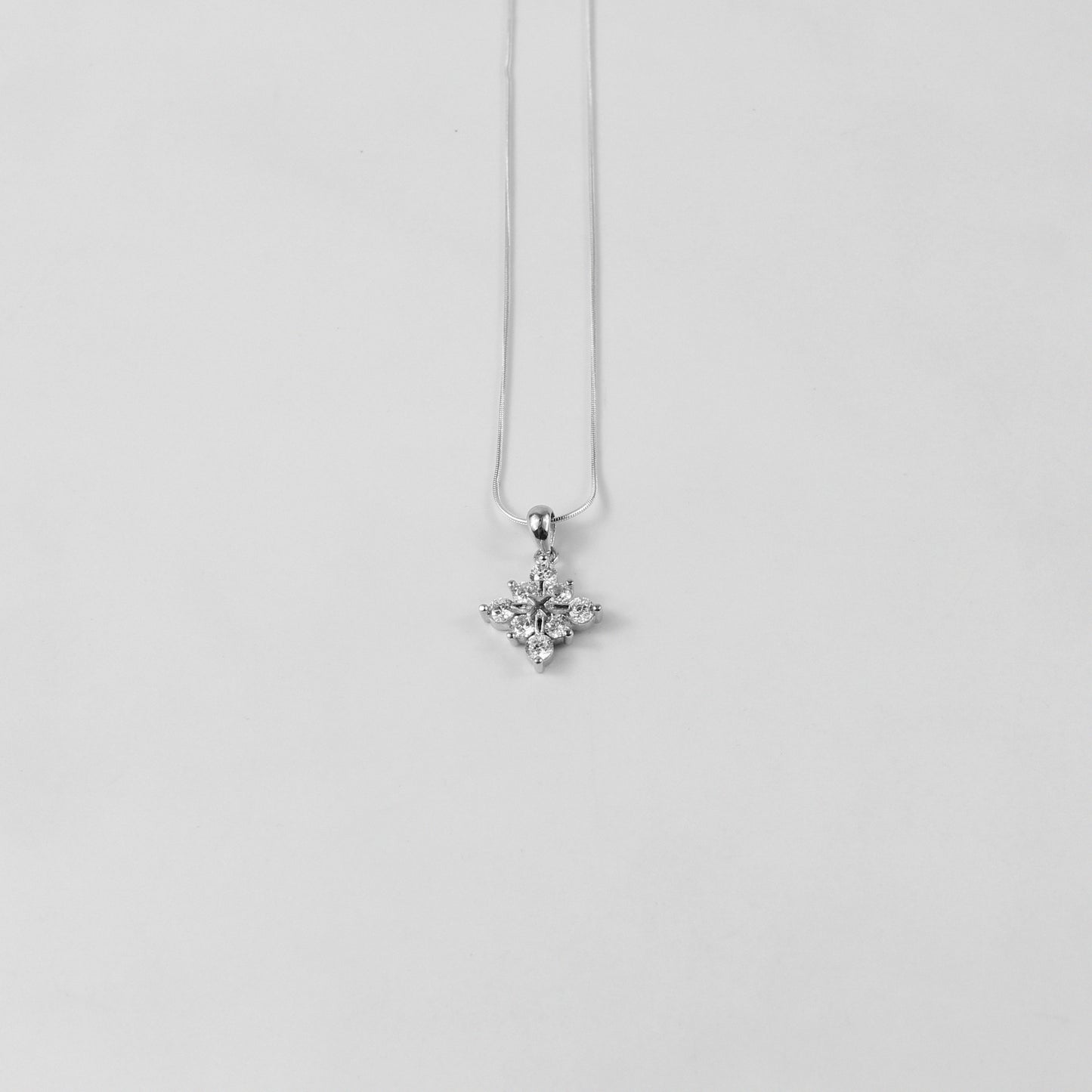 An elegant necklace named 'Lumine,' crafted from 925 sterling silver. Its radiant design captures the essence of light and brilliance, exuding a timeless and luminous charm.