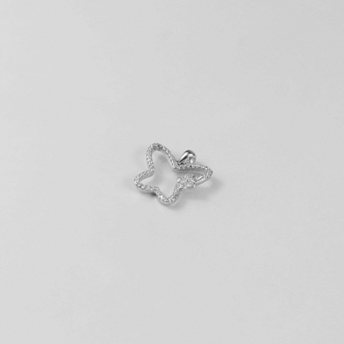 GETTHEJUICE-925STERLINGSILVER-Moonlit Flutter Necklace: A sterling silver necklace featuring a delicate butterfly charm with a moonlit glow, exuding elegance and grace.