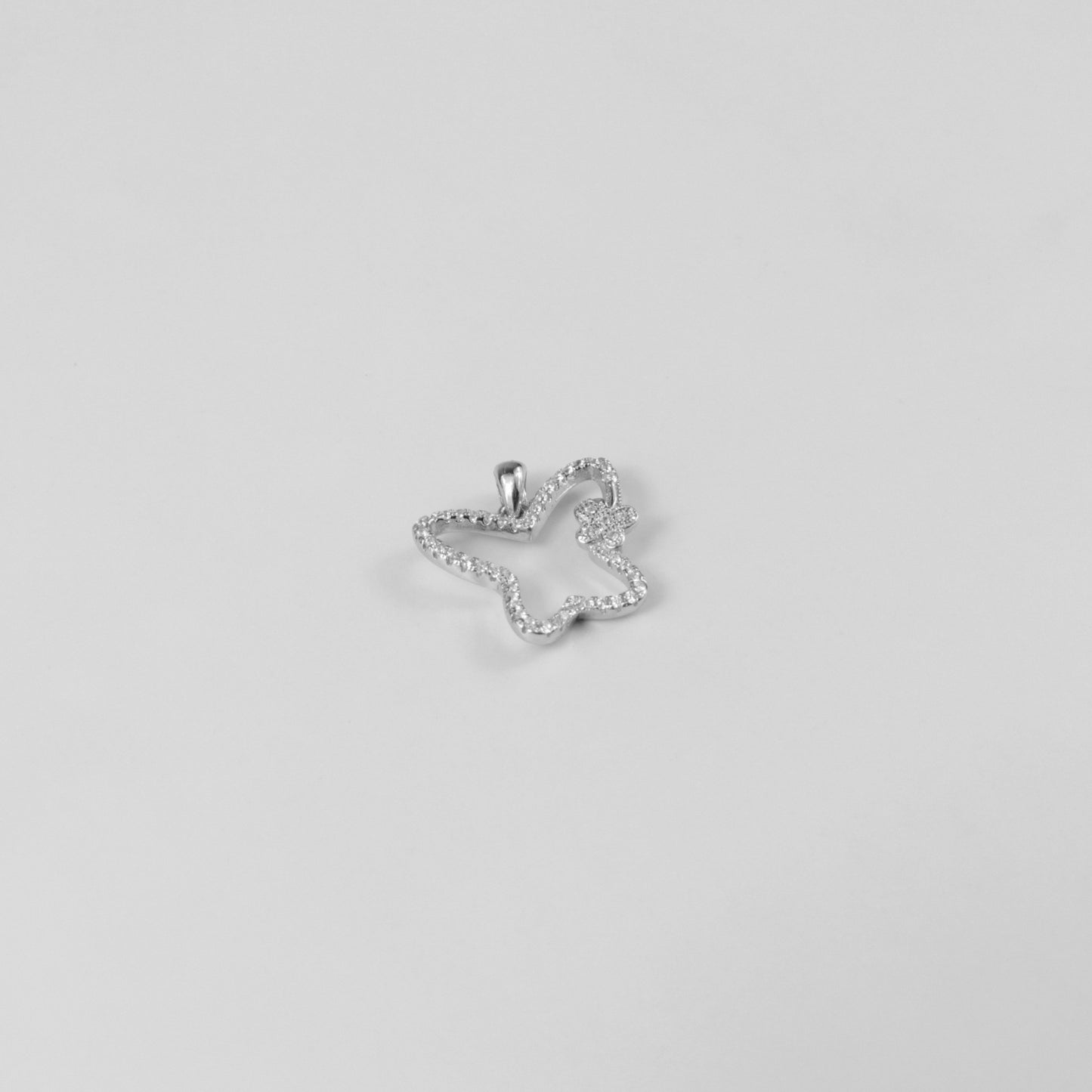 GETTHEJUICE-925STERLINGSILVER-Moonlit Flutter Necklace: A sterling silver necklace featuring a delicate butterfly charm with a moonlit glow, exuding elegance and grace.