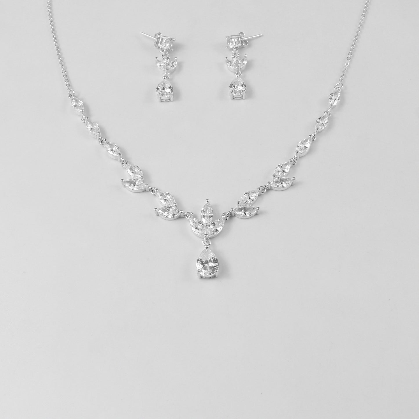 An elegant necklace named 'Moonlit Grace,' crafted from 925 sterling silver. Its design captures the serene beauty of moonlight with a graceful and timeless aesthetic.