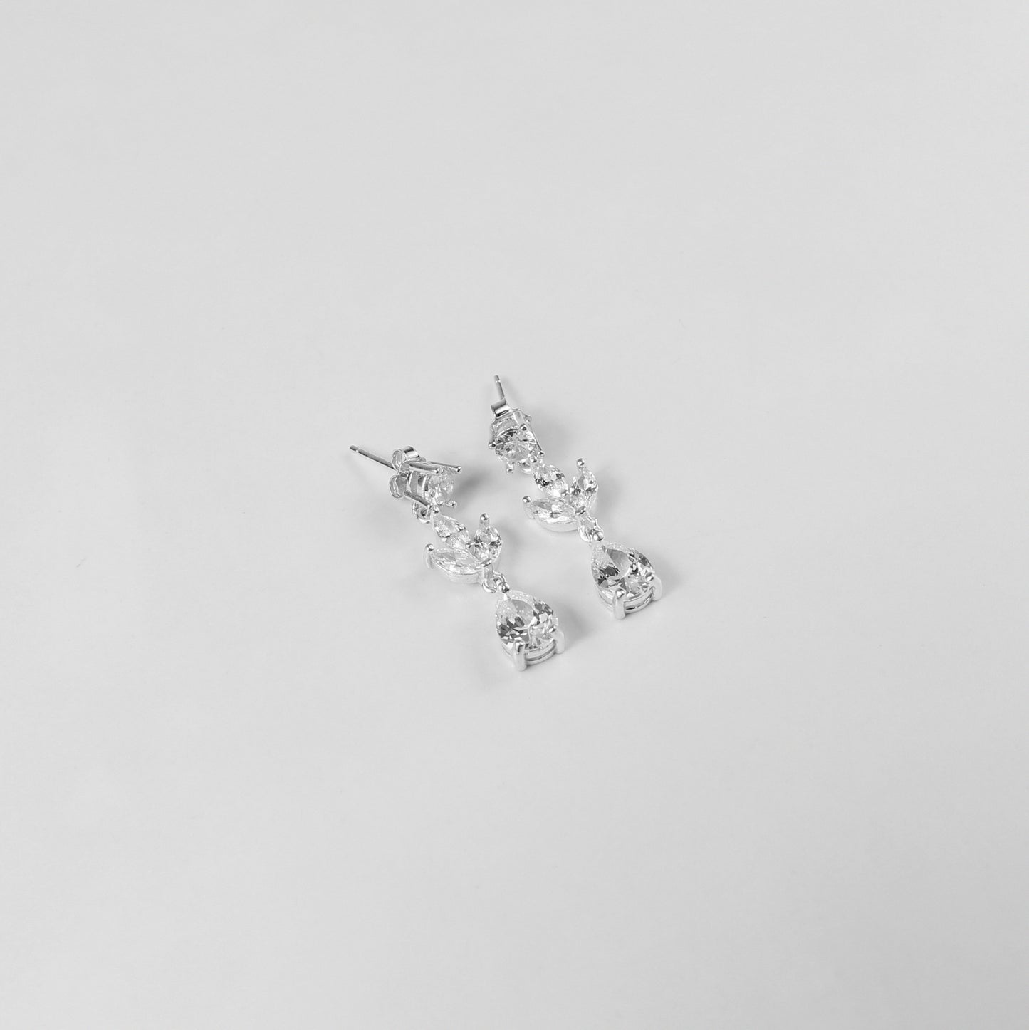 An elegant necklace named 'Moonlit Grace,' crafted from 925 sterling silver. Its design captures the serene beauty of moonlight with a graceful and timeless aesthetic.
