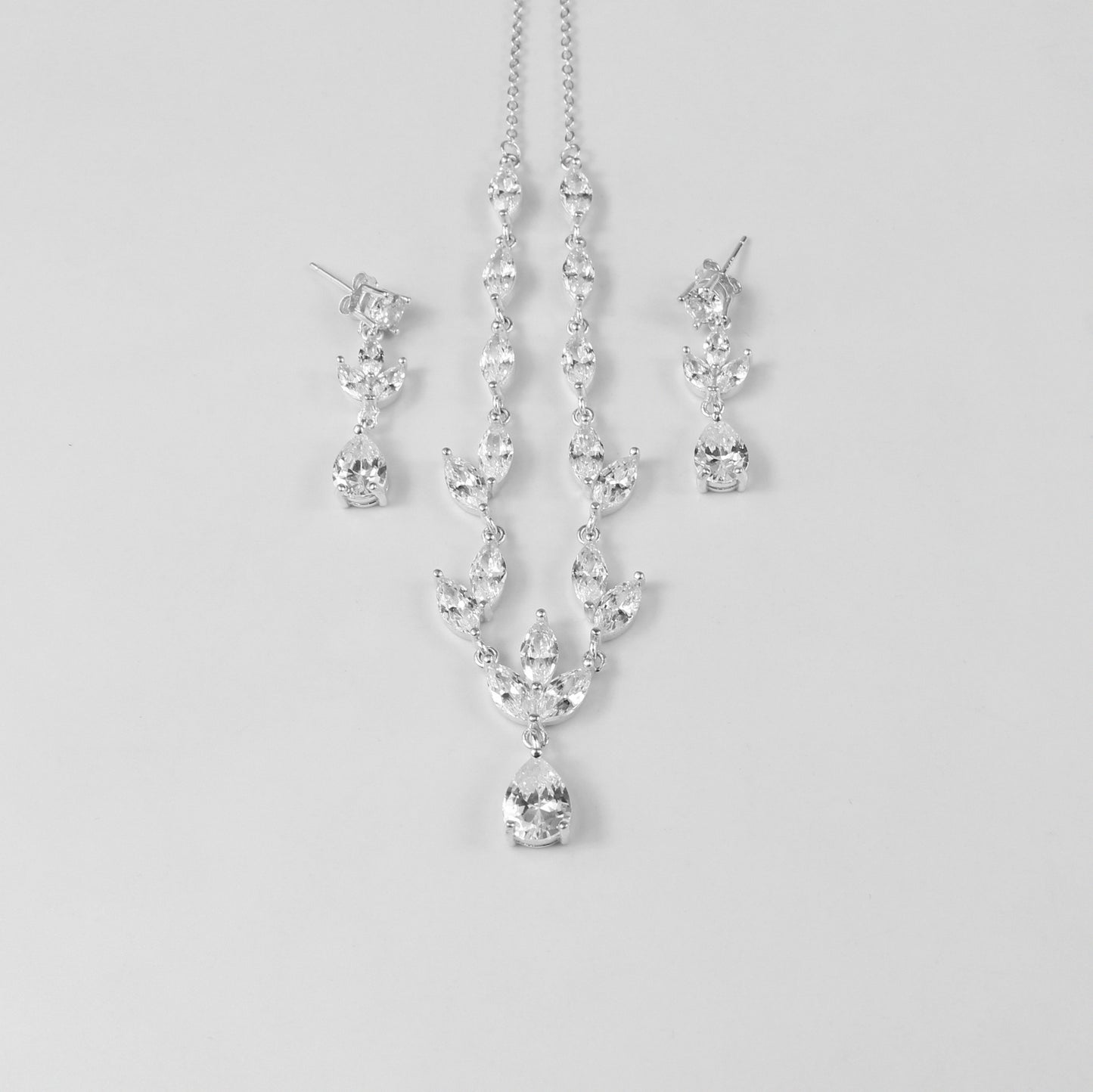 An elegant necklace named 'Moonlit Grace,' crafted from 925 sterling silver. Its design captures the serene beauty of moonlight with a graceful and timeless aesthetic.