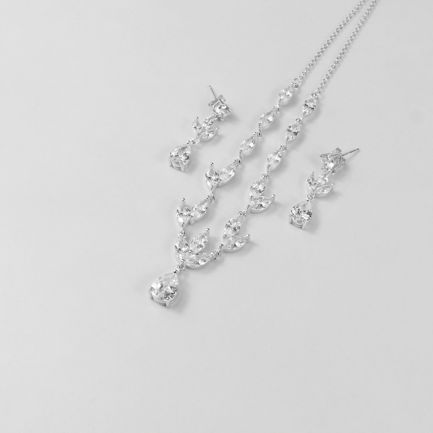 An elegant necklace named 'Moonlit Grace,' crafted from 925 sterling silver. Its design captures the serene beauty of moonlight with a graceful and timeless aesthetic.