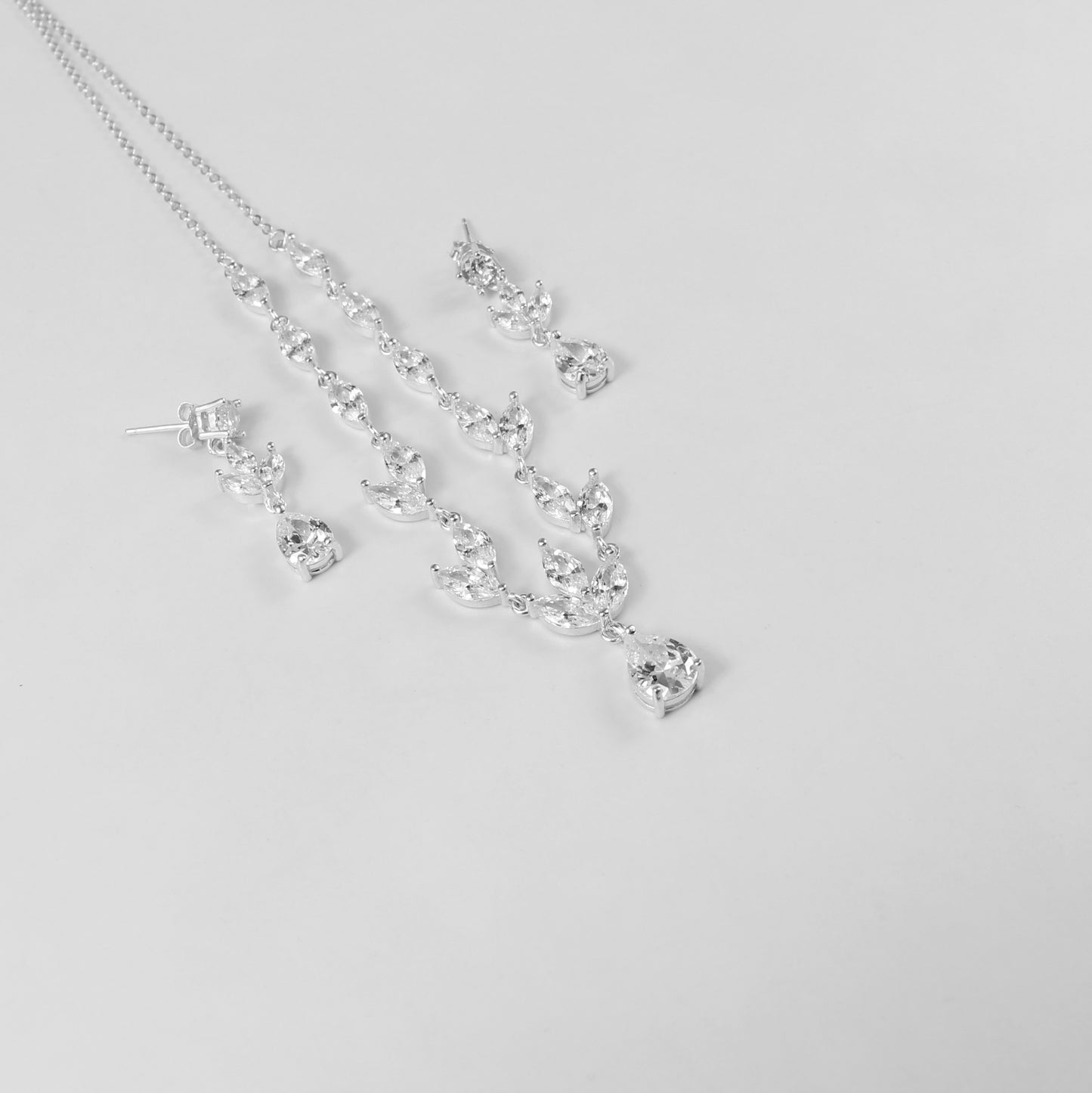 An elegant necklace named 'Moonlit Grace,' crafted from 925 sterling silver. Its design captures the serene beauty of moonlight with a graceful and timeless aesthetic.