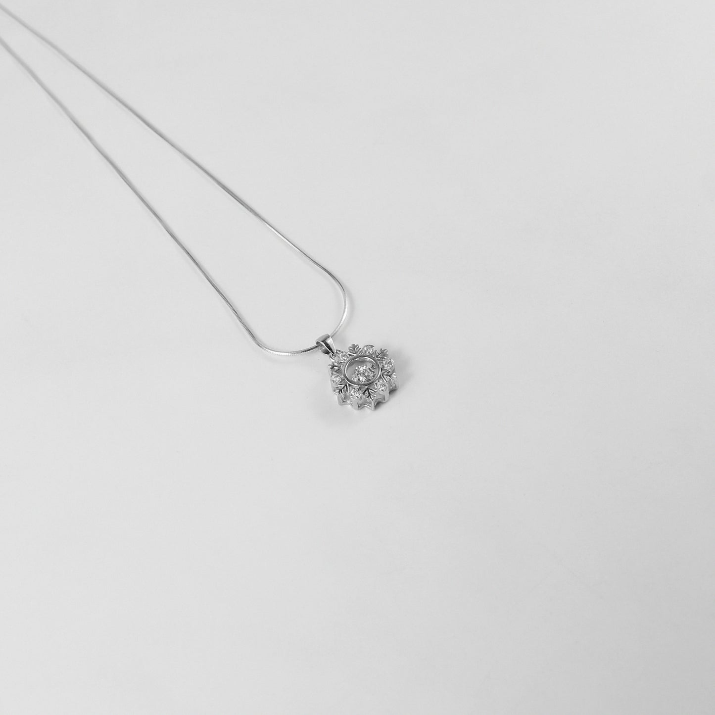 A captivating necklace named 'Opalina,' crafted from 925 sterling silver. Its design highlights the enchanting allure of opalescent hues, radiating elegance and charm.