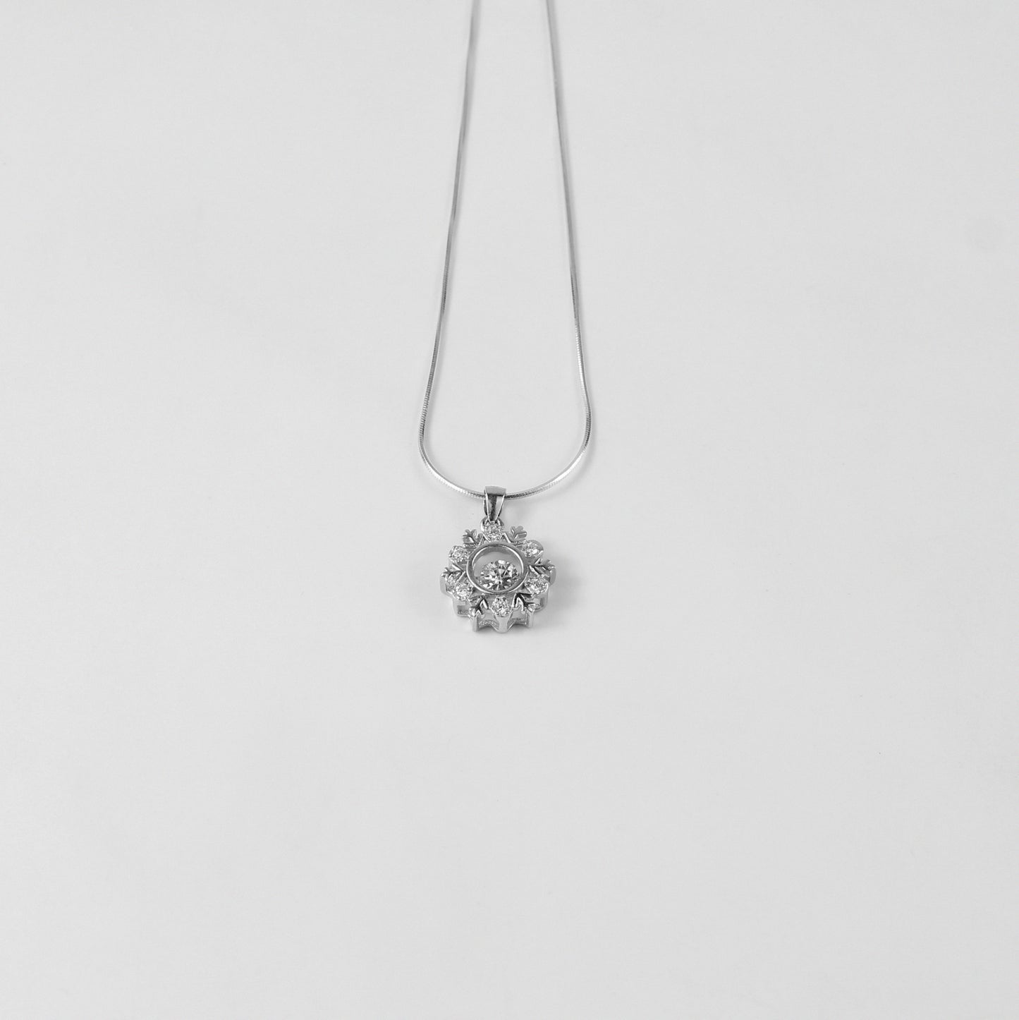 A captivating necklace named 'Opalina,' crafted from 925 sterling silver. Its design highlights the enchanting allure of opalescent hues, radiating elegance and charm.