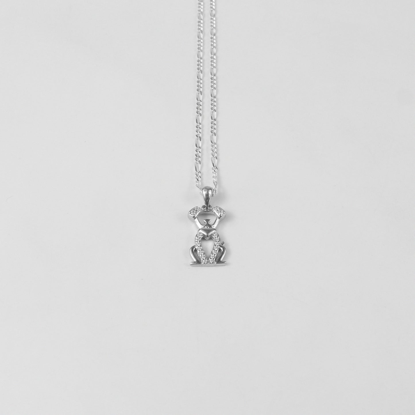 A delightful necklace named 'Puppy Sparkle,' crafted from 925 sterling silver. Its design captures the playful essence of a puppy's spirit, enhanced with dazzling details for a fun and elegant touch.
