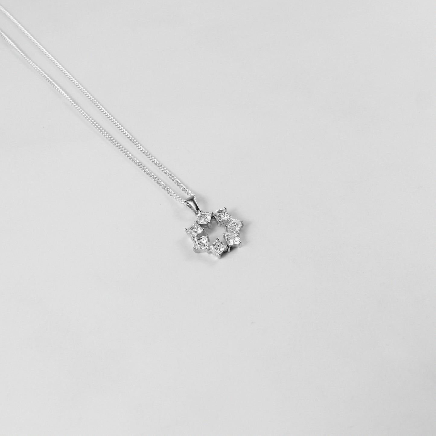 GETTHEJUICE-925STERLINGSILVER-Pure Glimmer Necklace: A sterling silver necklace radiating a subtle yet striking glow, designed to capture a sense of pure elegance and sophistication.