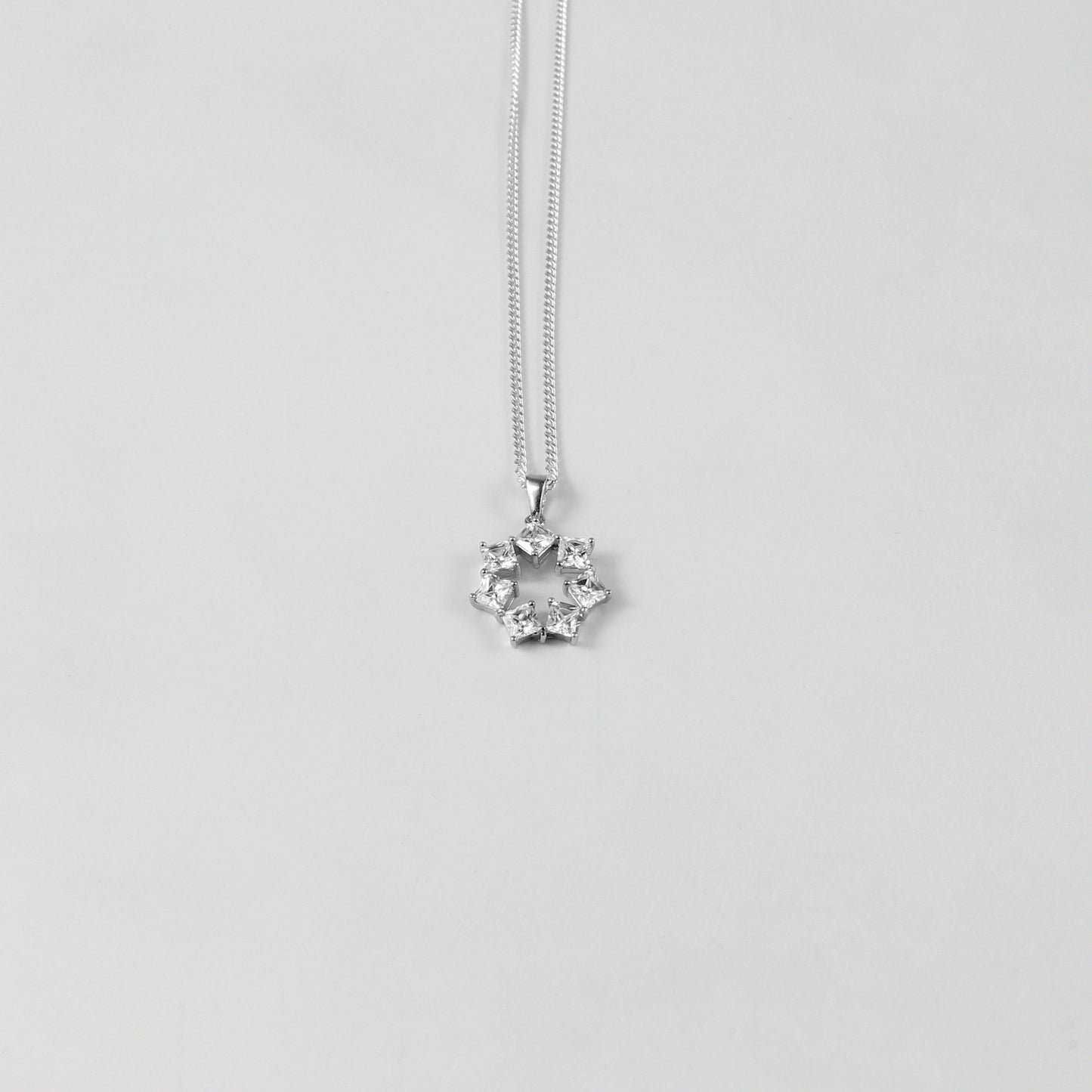 GETTHEJUICE-925STERLINGSILVER-Pure Glimmer Necklace: A sterling silver necklace radiating a subtle yet striking glow, designed to capture a sense of pure elegance and sophistication.