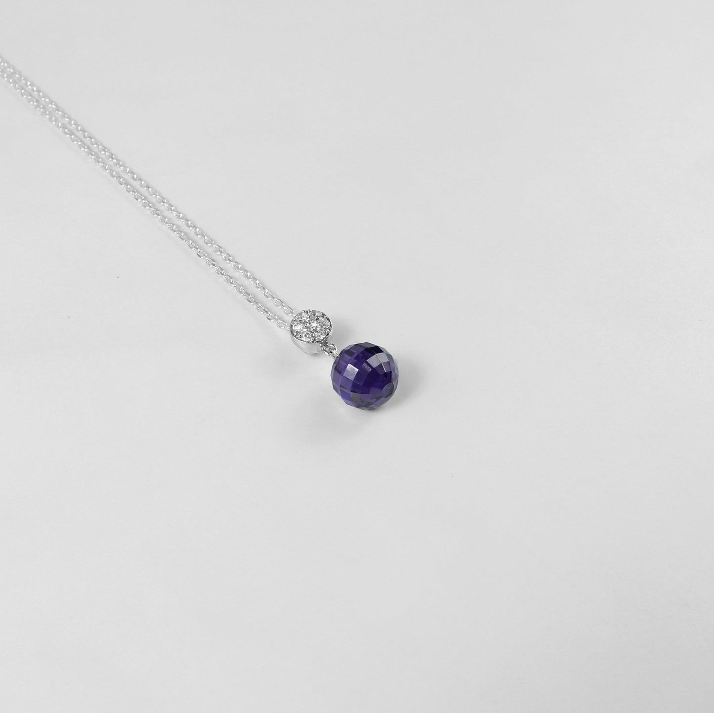 A beautiful necklace named 'Purple Charm,' crafted from 925 sterling silver. Its design features enchanting purple accents, exuding elegance and a touch of mystique.