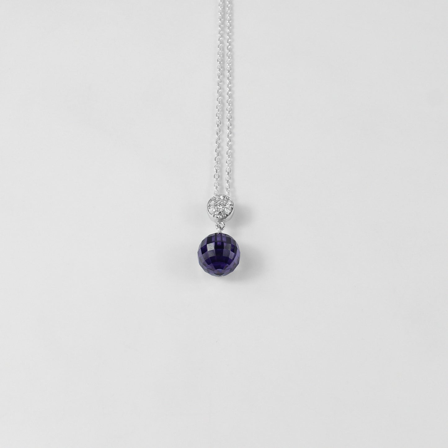 A beautiful necklace named 'Purple Charm,' crafted from 925 sterling silver. Its design features enchanting purple accents, exuding elegance and a touch of mystique.