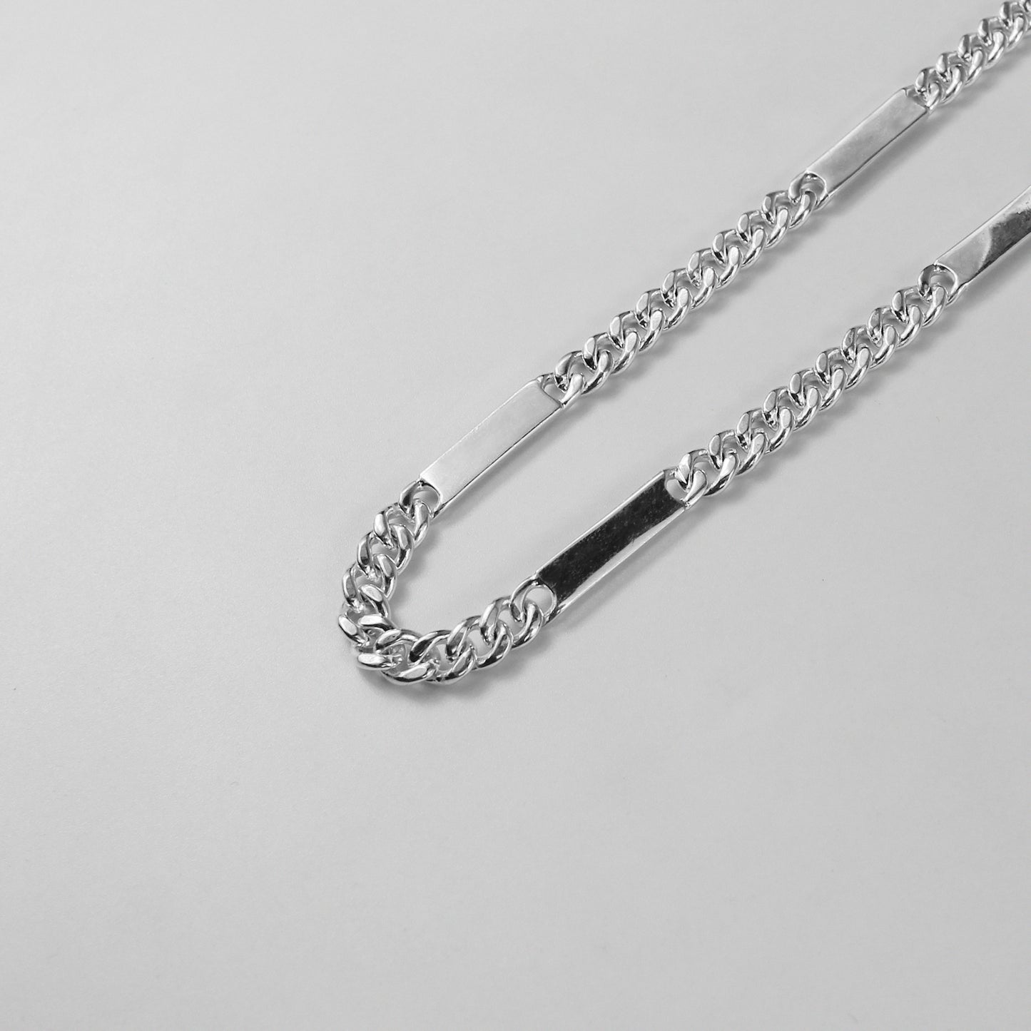 A modern necklace named 'RectaLink,' crafted from 925 sterling silver. Its design features sleek, rectangular links that create a bold and contemporary statement of style.