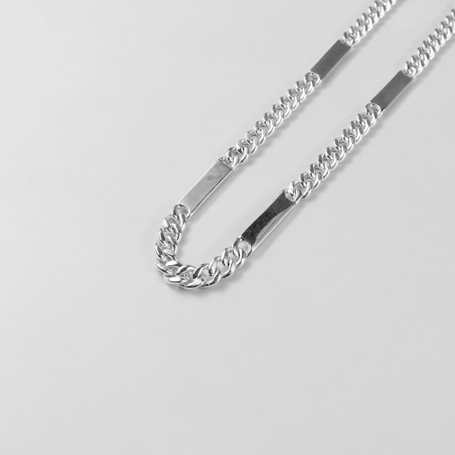 A modern necklace named 'RectaLink,' crafted from 925 sterling silver. Its design features sleek, rectangular links that create a bold and contemporary statement of style.