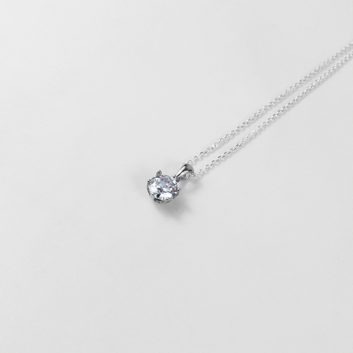 A refined necklace named 'Serenite,' crafted from 925 sterling silver. Its minimalist design embodies tranquility and grace, making it a versatile and elegant accessory.