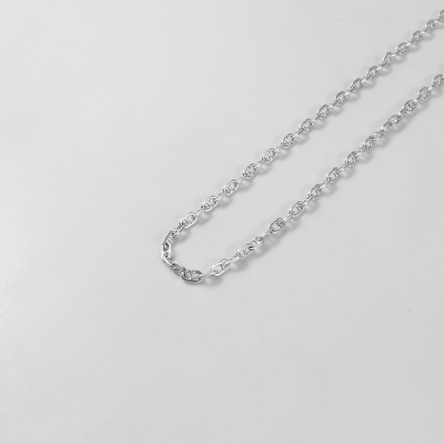 925 sterling silver necklace named 'Silver Lattice,' showcasing an intricate openwork design reminiscent of a delicate lattice pattern. Its elegant and airy craftsmanship exudes sophistication, making it a versatile and timeless accessory.