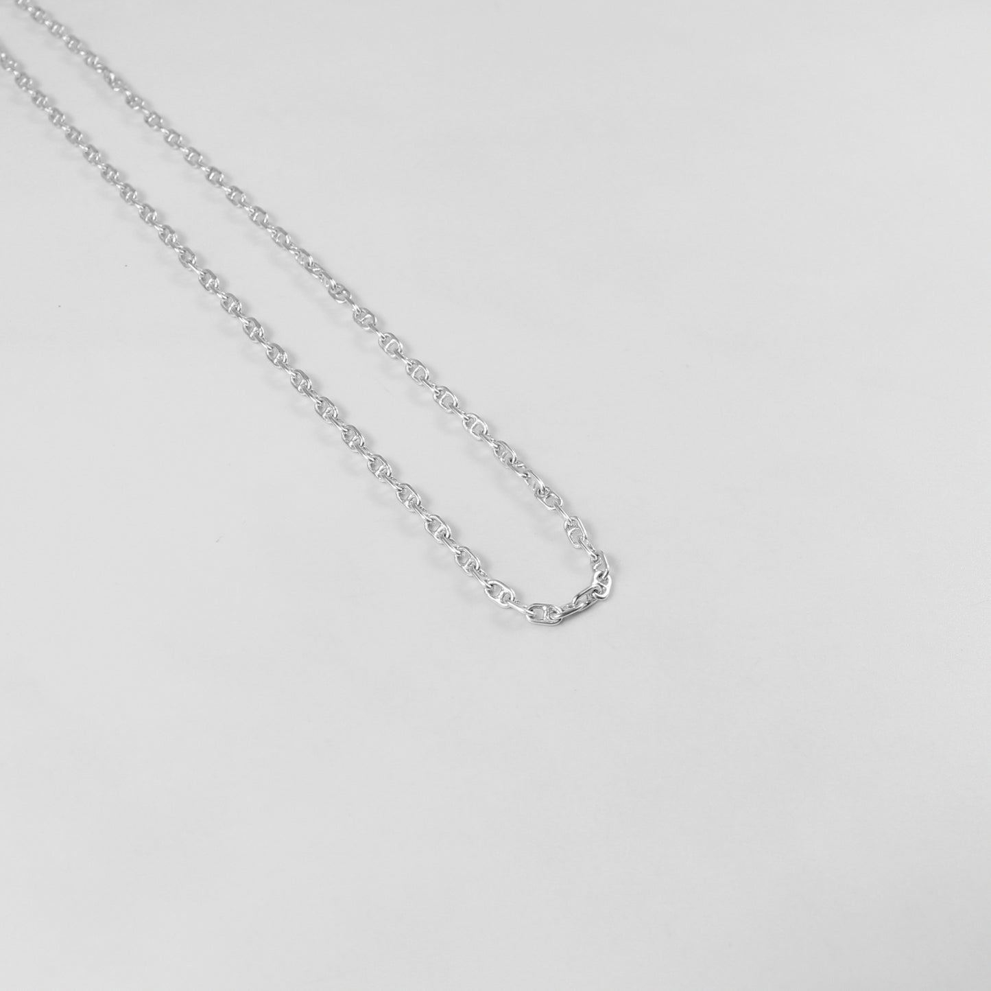 925 sterling silver necklace named 'Silver Lattice,' showcasing an intricate openwork design reminiscent of a delicate lattice pattern. Its elegant and airy craftsmanship exudes sophistication, making it a versatile and timeless accessory.