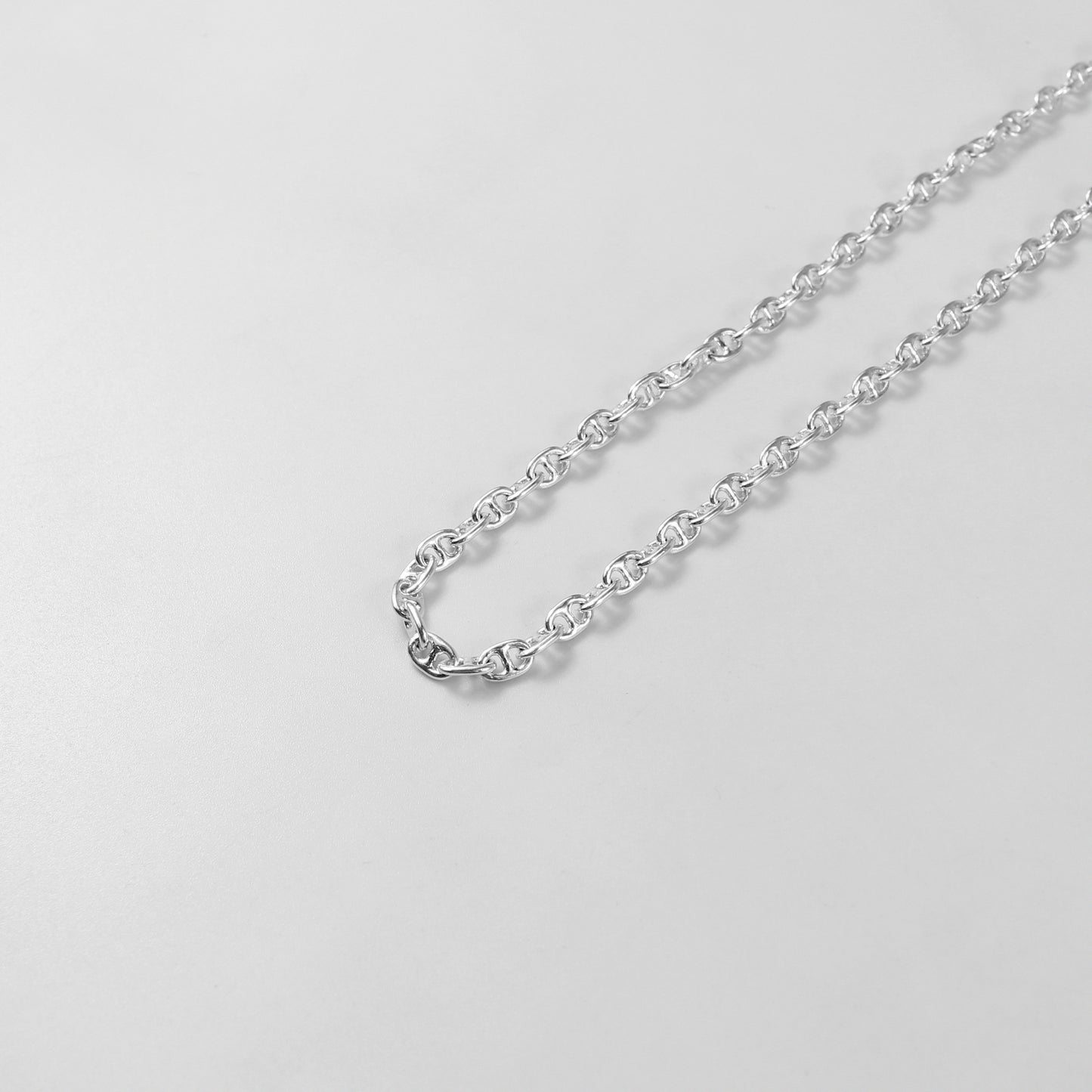 925 sterling silver necklace named 'Silver Lattice,' showcasing an intricate openwork design reminiscent of a delicate lattice pattern. Its elegant and airy craftsmanship exudes sophistication, making it a versatile and timeless accessory.