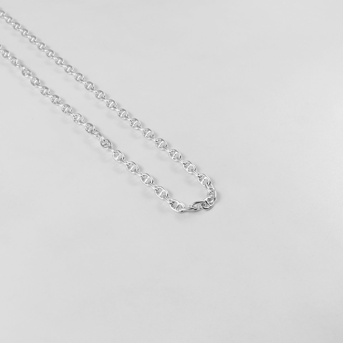 925 sterling silver necklace named 'Silver Lattice,' showcasing an intricate openwork design reminiscent of a delicate lattice pattern. Its elegant and airy craftsmanship exudes sophistication, making it a versatile and timeless accessory.