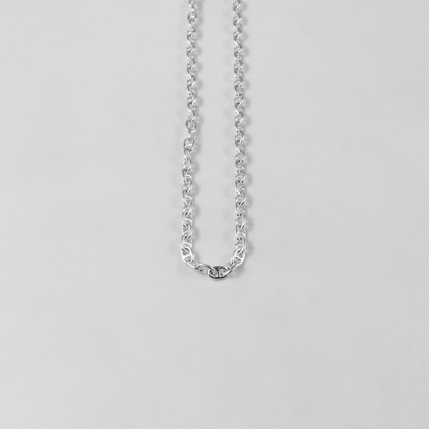 925 sterling silver necklace named 'Silver Lattice,' showcasing an intricate openwork design reminiscent of a delicate lattice pattern. Its elegant and airy craftsmanship exudes sophistication, making it a versatile and timeless accessory.