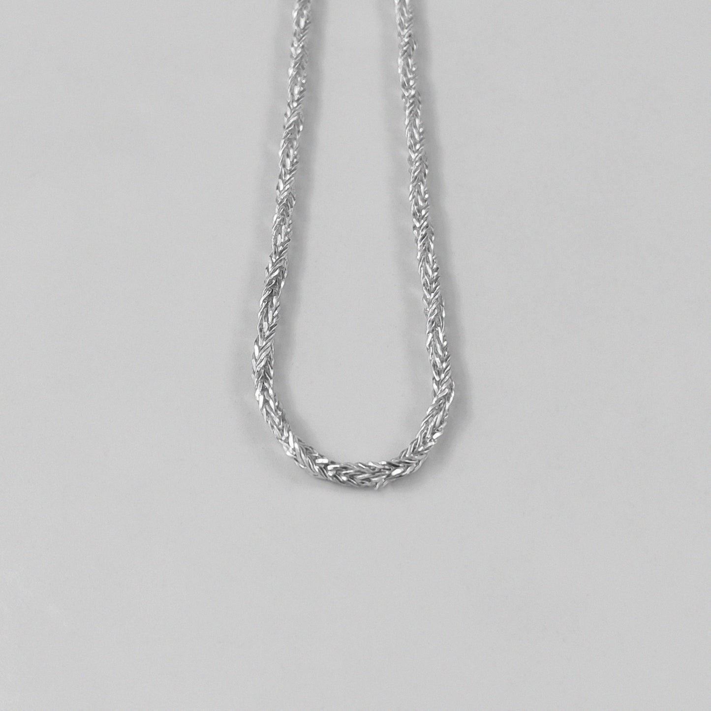 Starlit Weave Necklace - An elegant 925 sterling silver necklace by GetTheJuice, showcasing a delicate starlit weave pattern that brings a celestial charm to your ensemble.