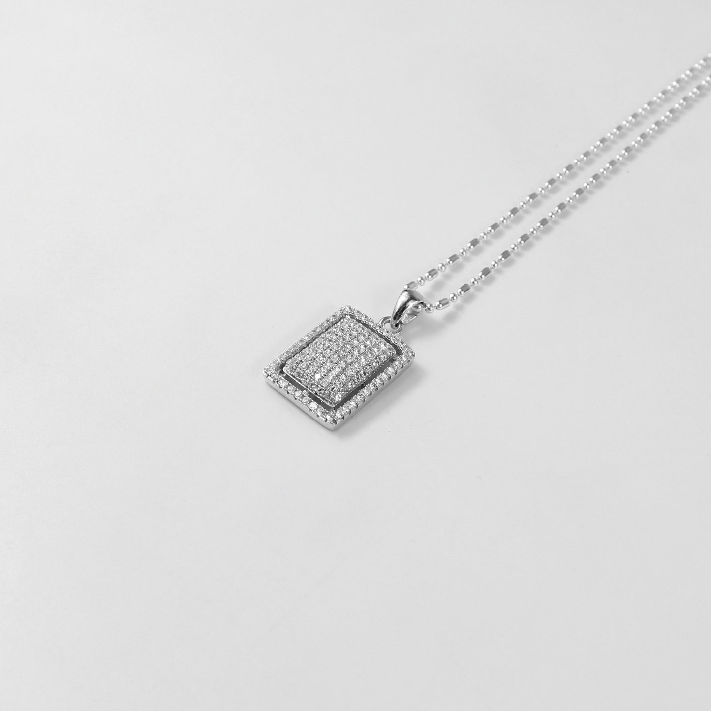 An enchanting necklace named 'Stella Luxe,' featuring intricate details in 925 sterling silver, capturing the luminous beauty of starlight in a luxurious form.