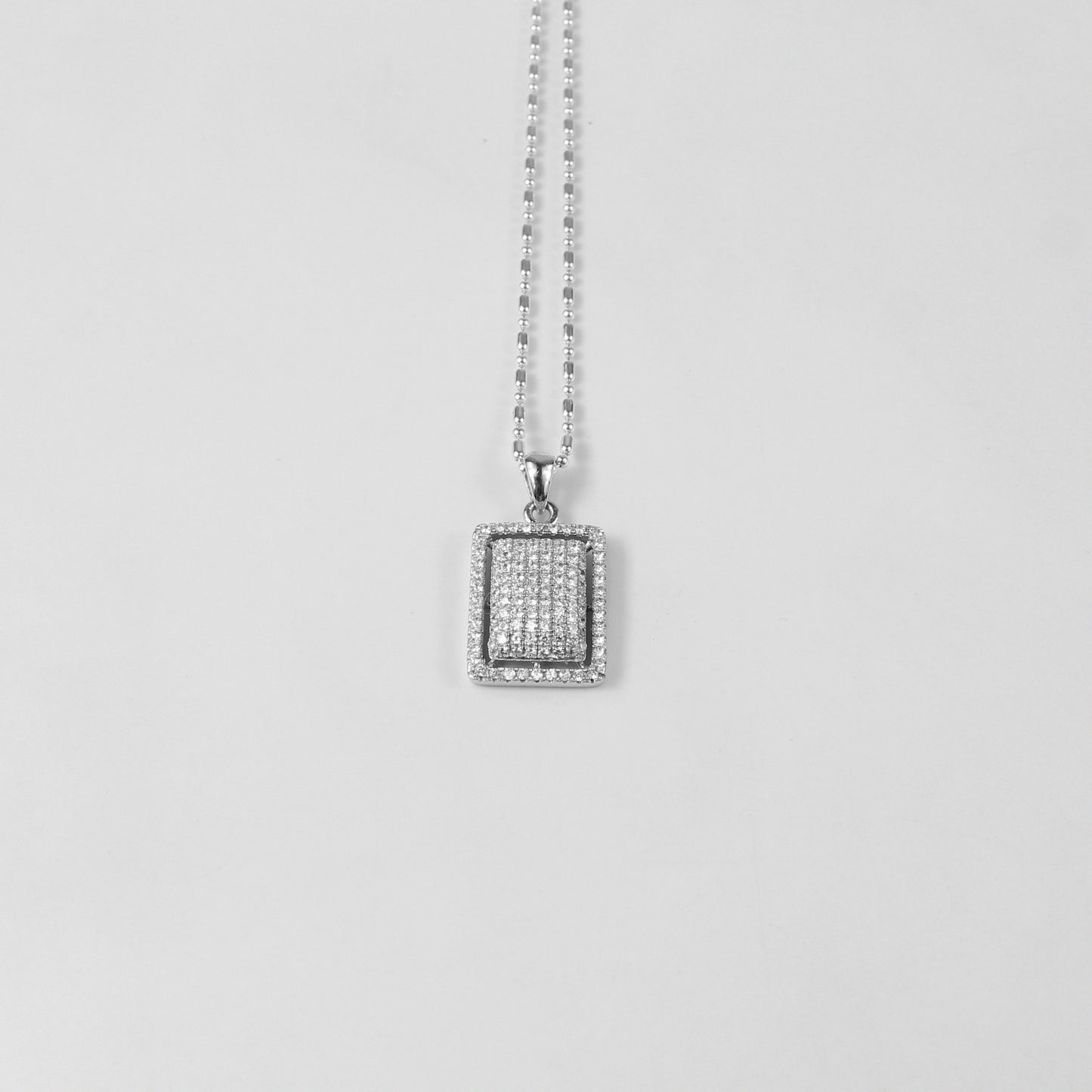 An enchanting necklace named 'Stella Luxe,' featuring intricate details in 925 sterling silver, capturing the luminous beauty of starlight in a luxurious form.