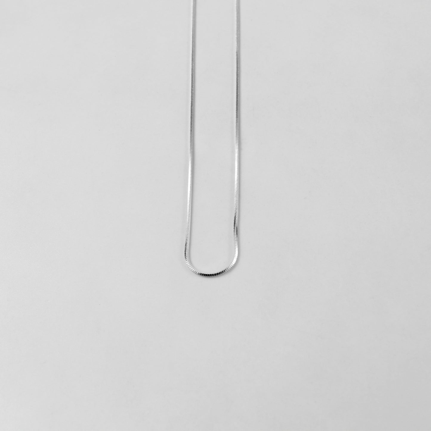 925 sterling silver necklace named 'Thin Radiant Veil,' featuring a refined and delicate design with shimmering accents that emulate the elegance of a flowing, ethereal veil. Its minimalist charm and graceful aesthetic make it a perfect accessory for any occasion.