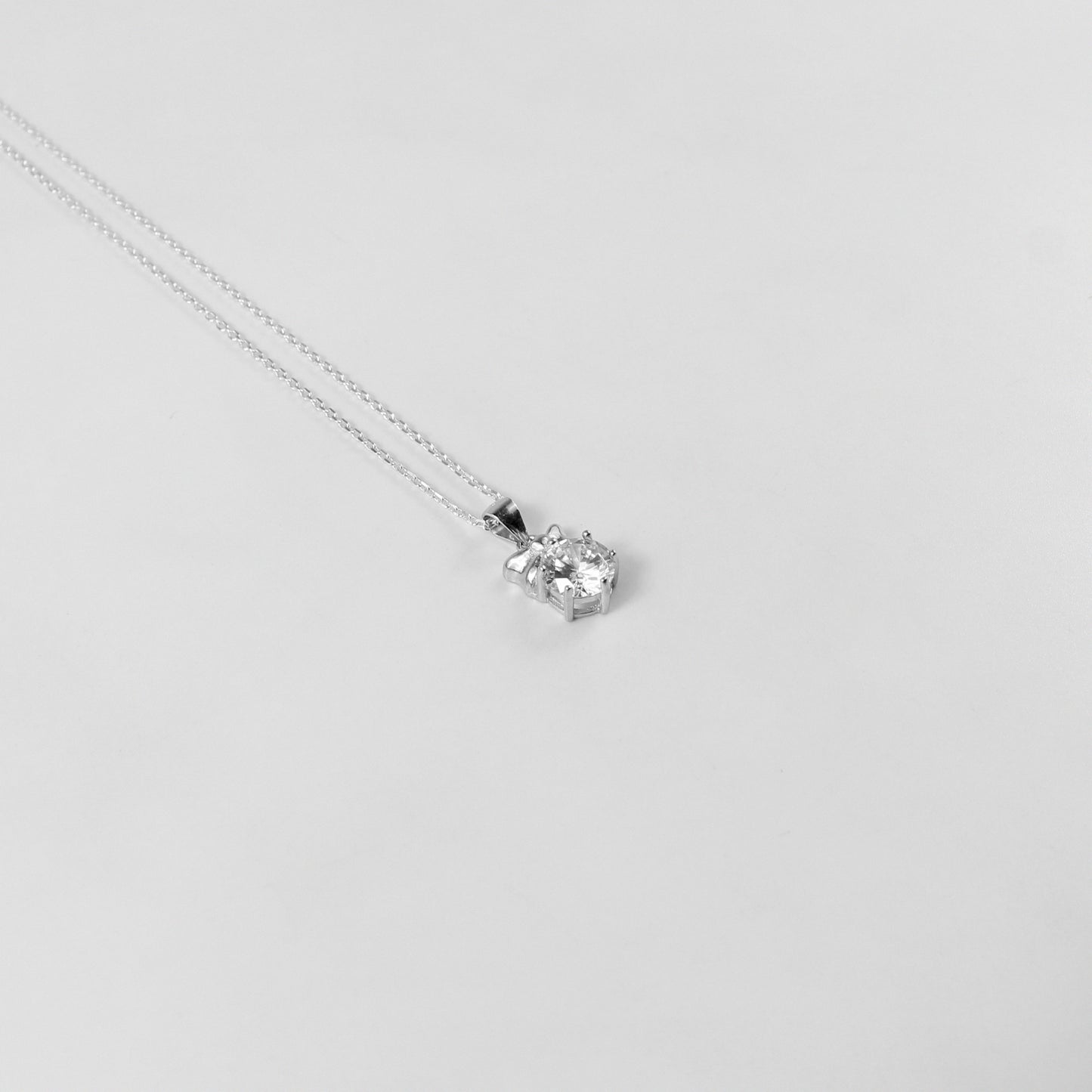 GETTHEJUICE-925STERLINGSILVER-White Veil Necklace: A sterling silver necklace with an ethereal design resembling a delicate veil, offering a timeless and graceful charm.