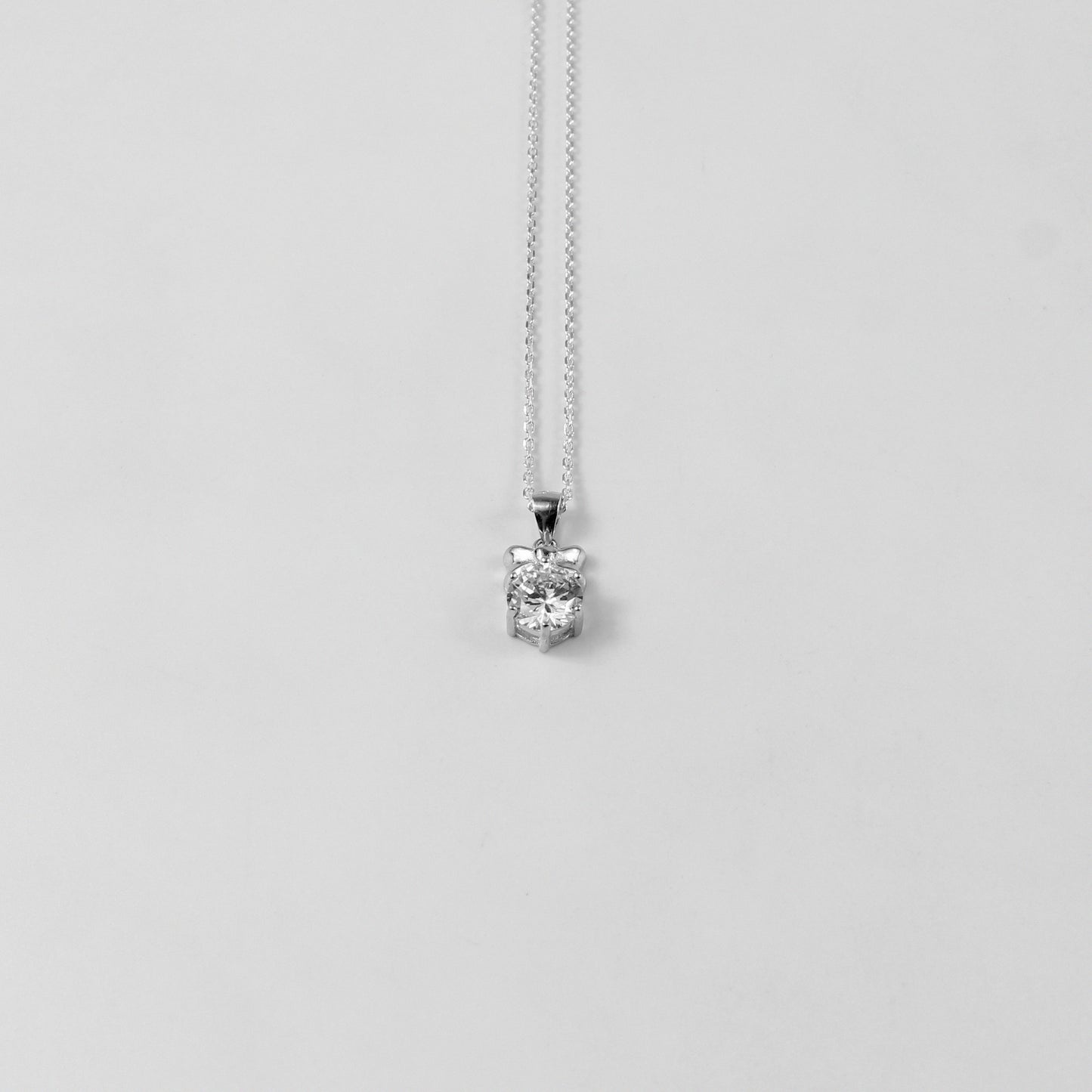 GETTHEJUICE-925STERLINGSILVER-White Veil Necklace: A sterling silver necklace with an ethereal design resembling a delicate veil, offering a timeless and graceful charm.