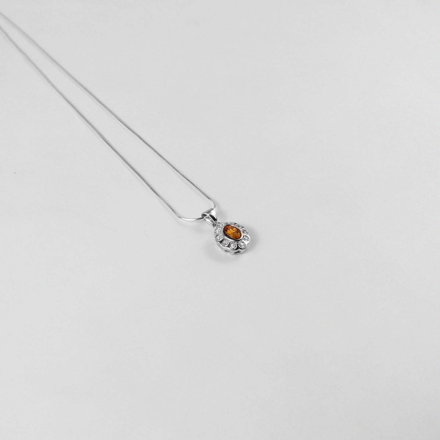 A vibrant necklace named 'Yellow Echo,' crafted from 925 sterling silver. Its design features radiant yellow accents, evoking warmth and energy with a modern, stylish flair.
