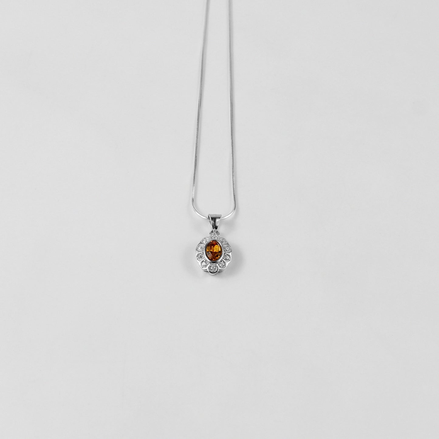 A vibrant necklace named 'Yellow Echo,' crafted from 925 sterling silver. Its design features radiant yellow accents, evoking warmth and energy with a modern, stylish flair.