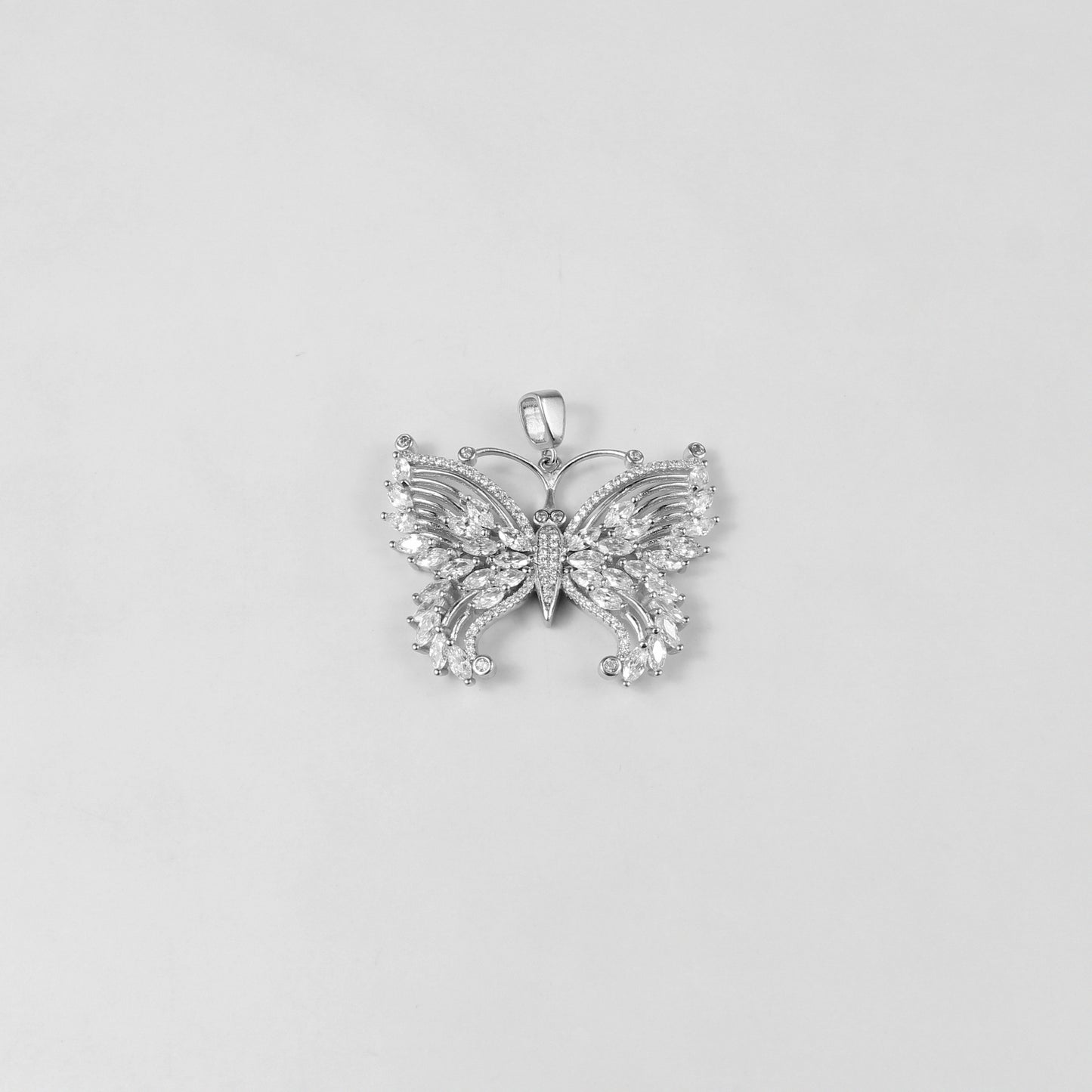 The 'Lunar Flutter' pendant, a luxurious 925 sterling silver creation, combining celestial motifs with a fluttering design for timeless charm.