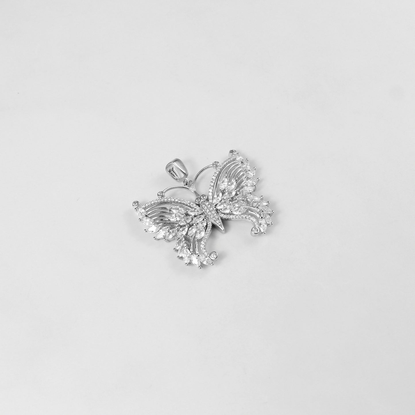 The 'Lunar Flutter' pendant, a luxurious 925 sterling silver creation, combining celestial motifs with a fluttering design for timeless charm.