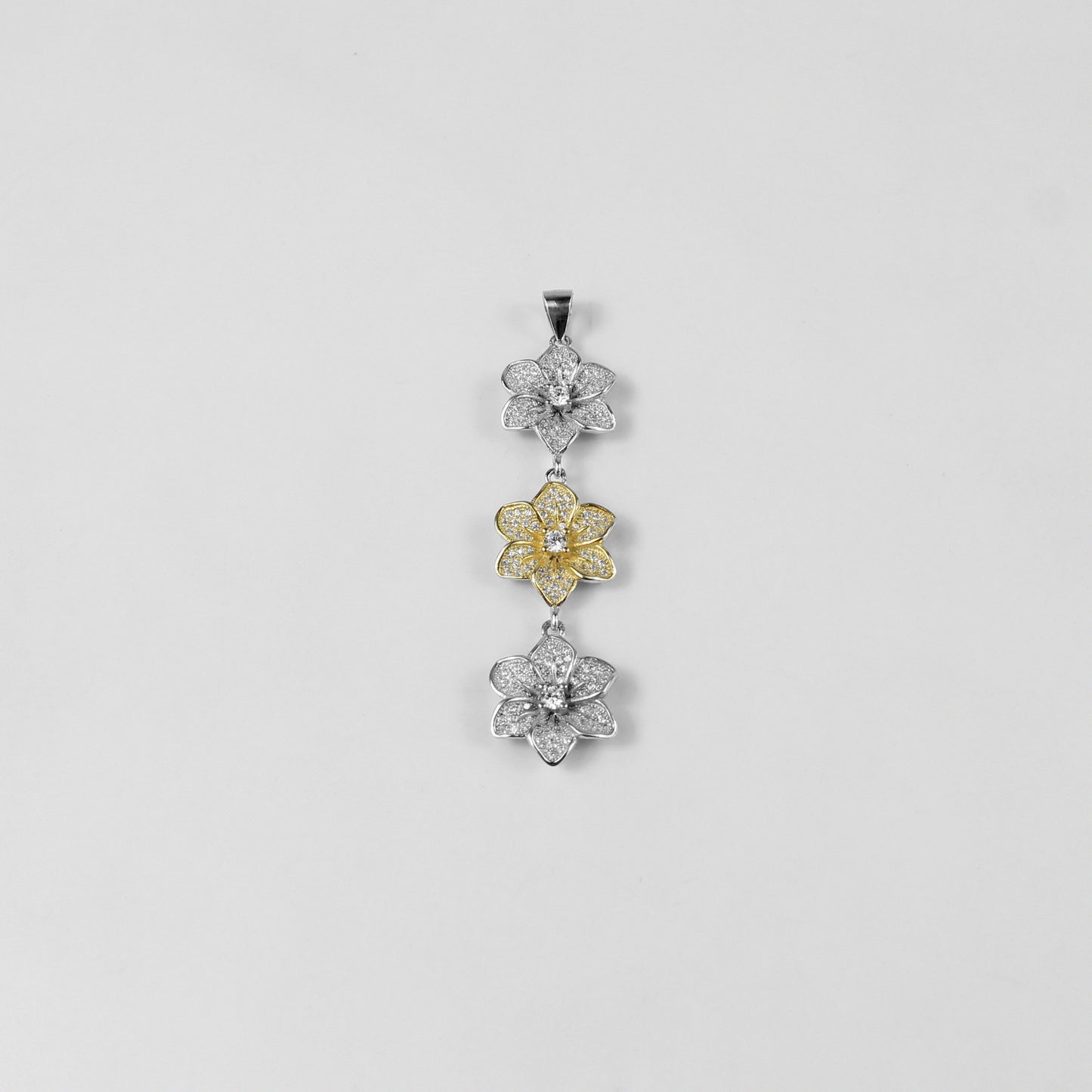 The 'Trinity Bloom' pendant, a graceful piece of 925 sterling silver jewelry, inspired by the beauty of three interconnected flowers representing unity.