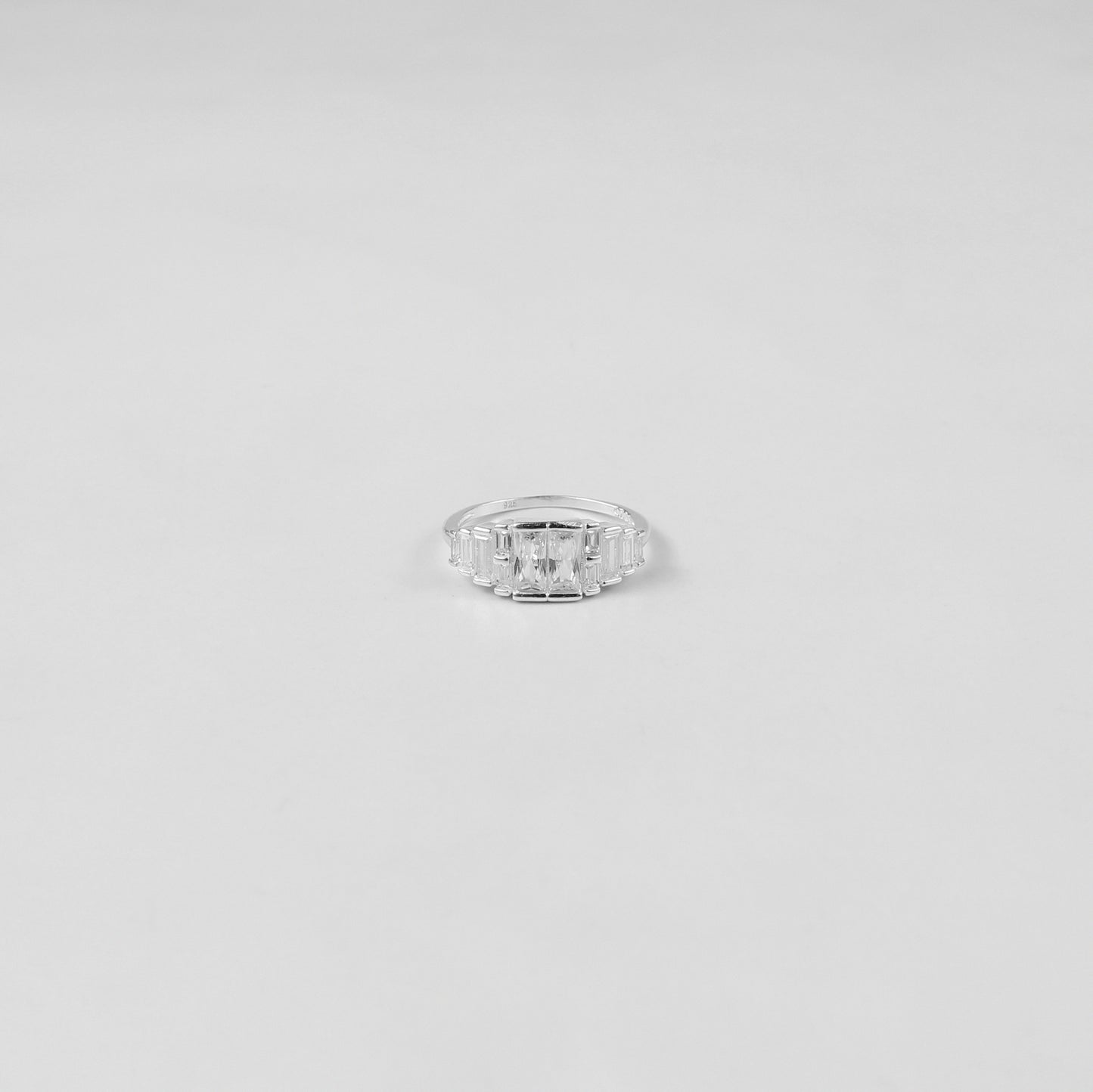 A refined sterling silver ring named 'Prismatic Elegance,' featuring a modern and sophisticated design that captures the interplay of light and angles. A perfect choice for those who value understated luxury.