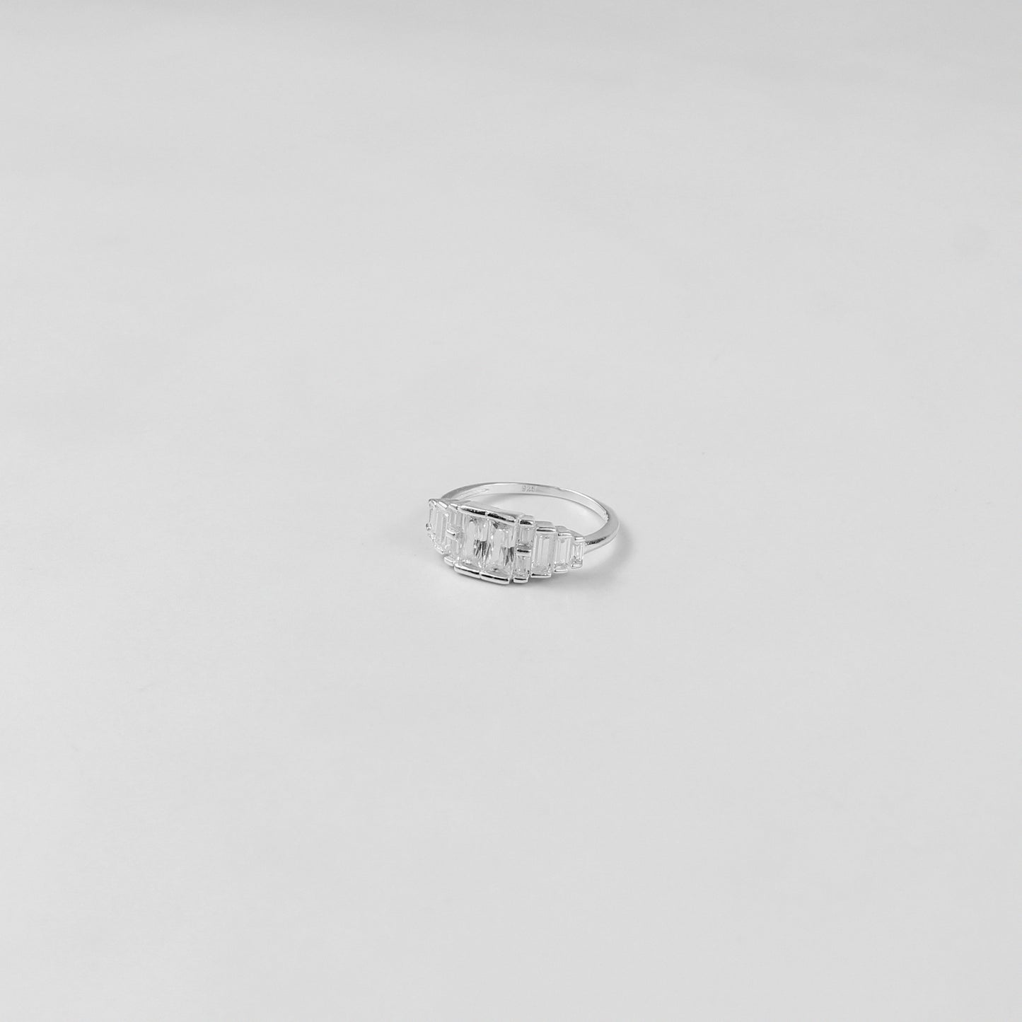 A refined sterling silver ring named 'Prismatic Elegance,' featuring a modern and sophisticated design that captures the interplay of light and angles. A perfect choice for those who value understated luxury.
