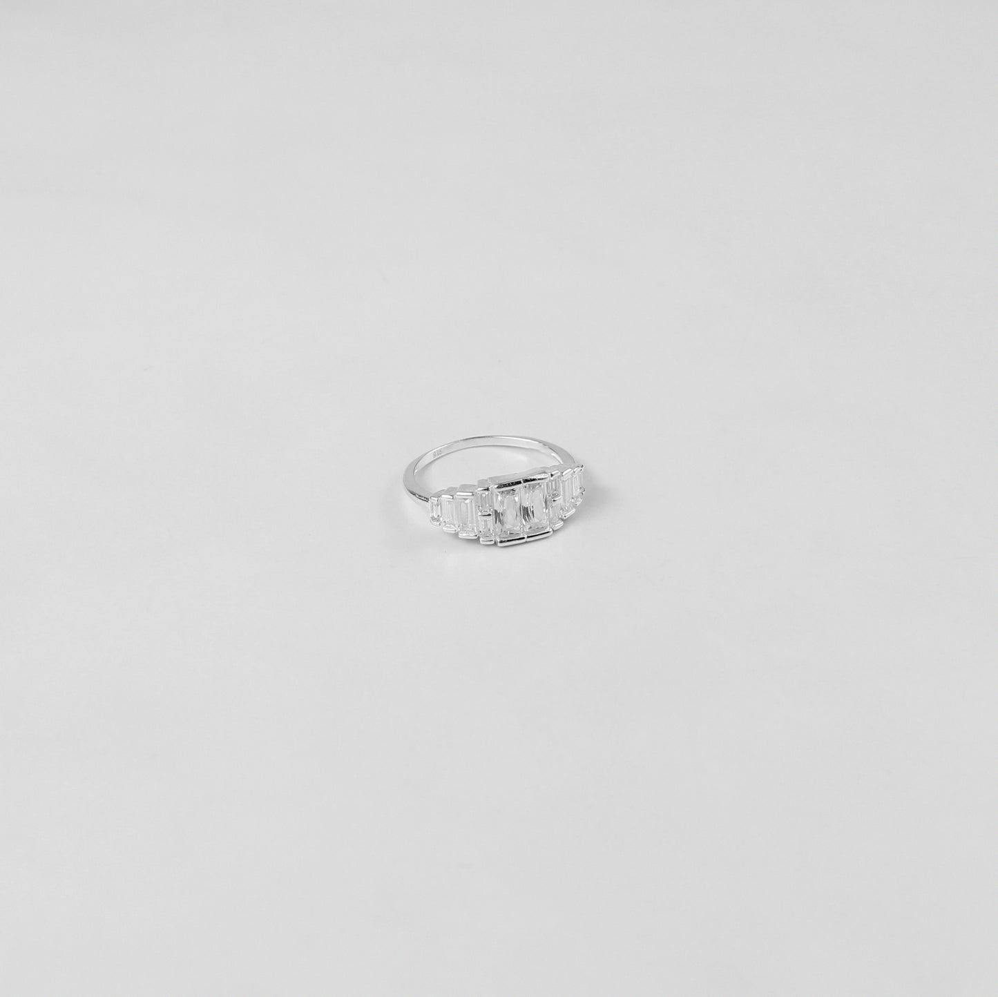 A refined sterling silver ring named 'Prismatic Elegance,' featuring a modern and sophisticated design that captures the interplay of light and angles. A perfect choice for those who value understated luxury.