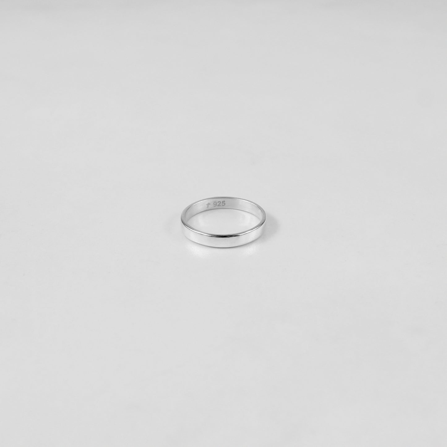 Sterling silver ring stamped '925,' featuring a refined circular design, named 'Circle of Elegance Ring.